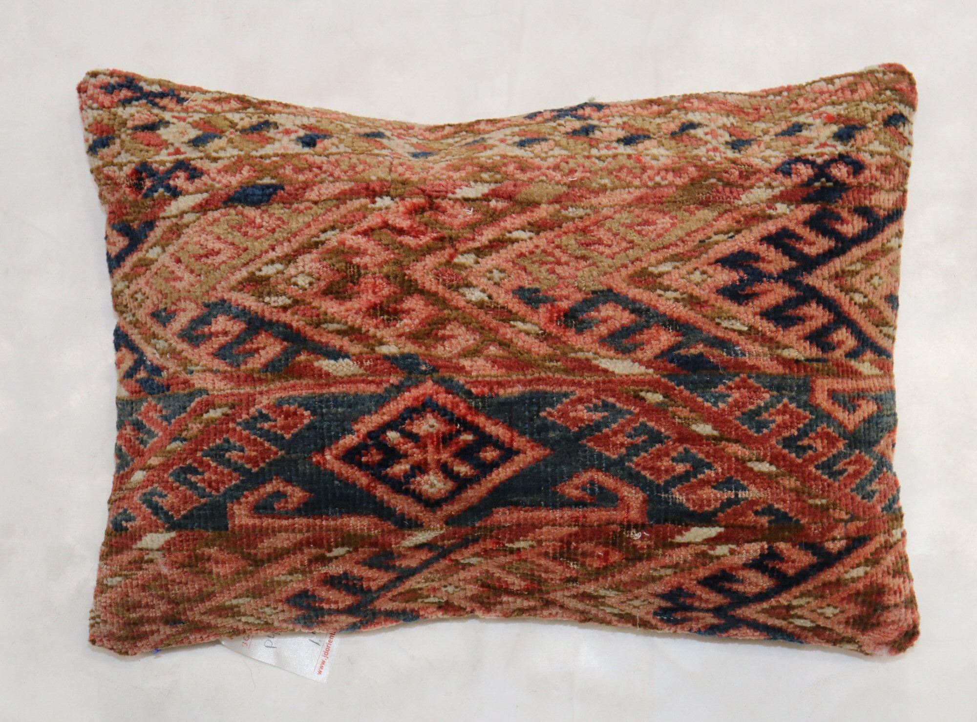 Pillow made from a 19th-century Turkeman rug in a lumbar size.

Measures: 13