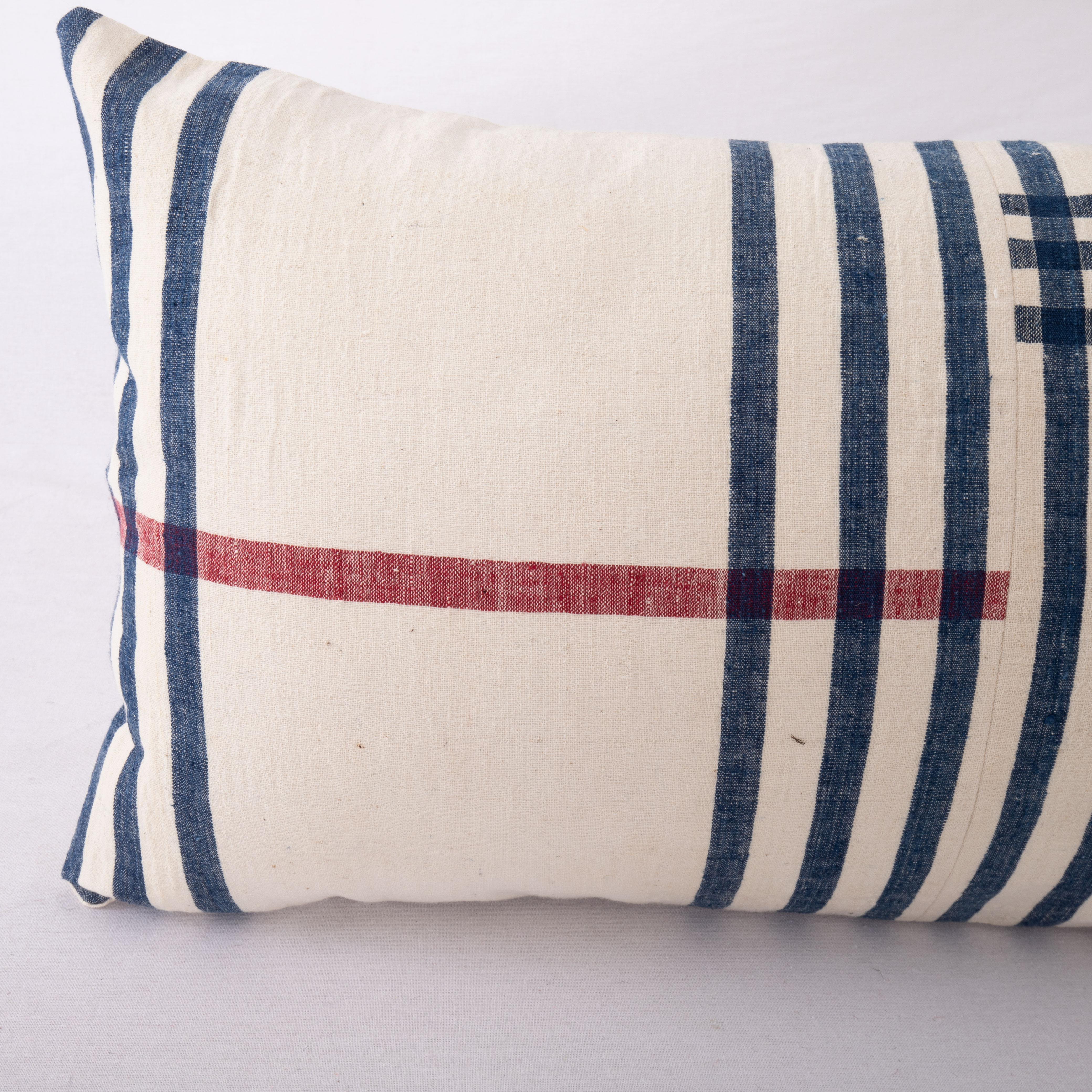 Rustic Lumbar Pillow Cover Made from a Vintage Anatolian Cotton Weaving, Mid 20th C. For Sale