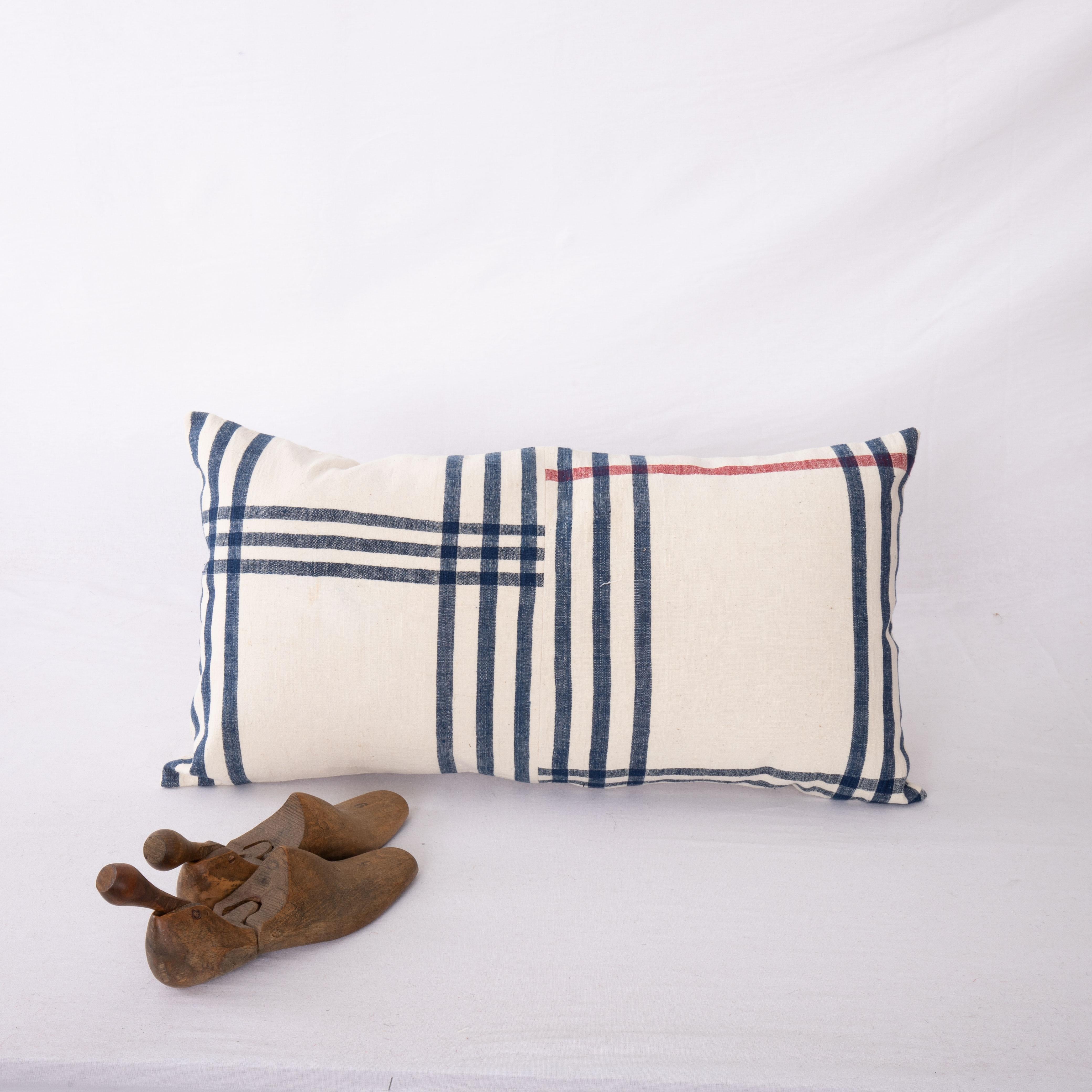 Rustic Lumbar Pillow Cover Made from a Vintage Anatolian Cotton Weaving, Mid 20th C. For Sale