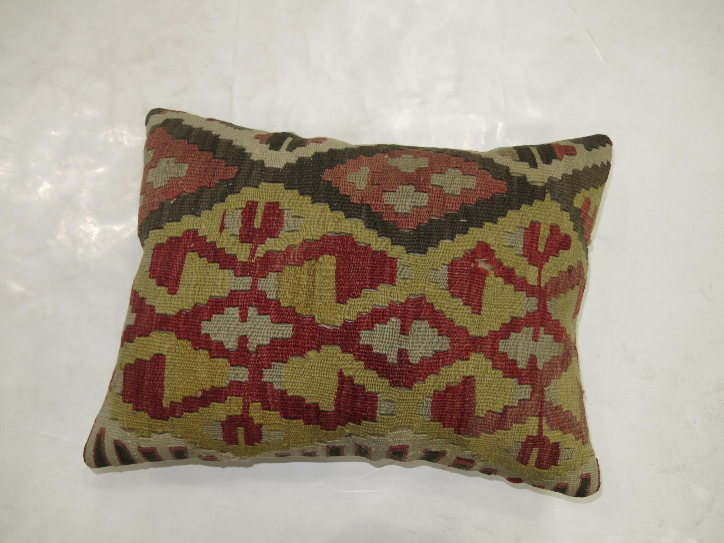 Pillow made from a vintage Turkish kilim with cotton back. Zipper closure and foam insert provided. 
Measures: 15