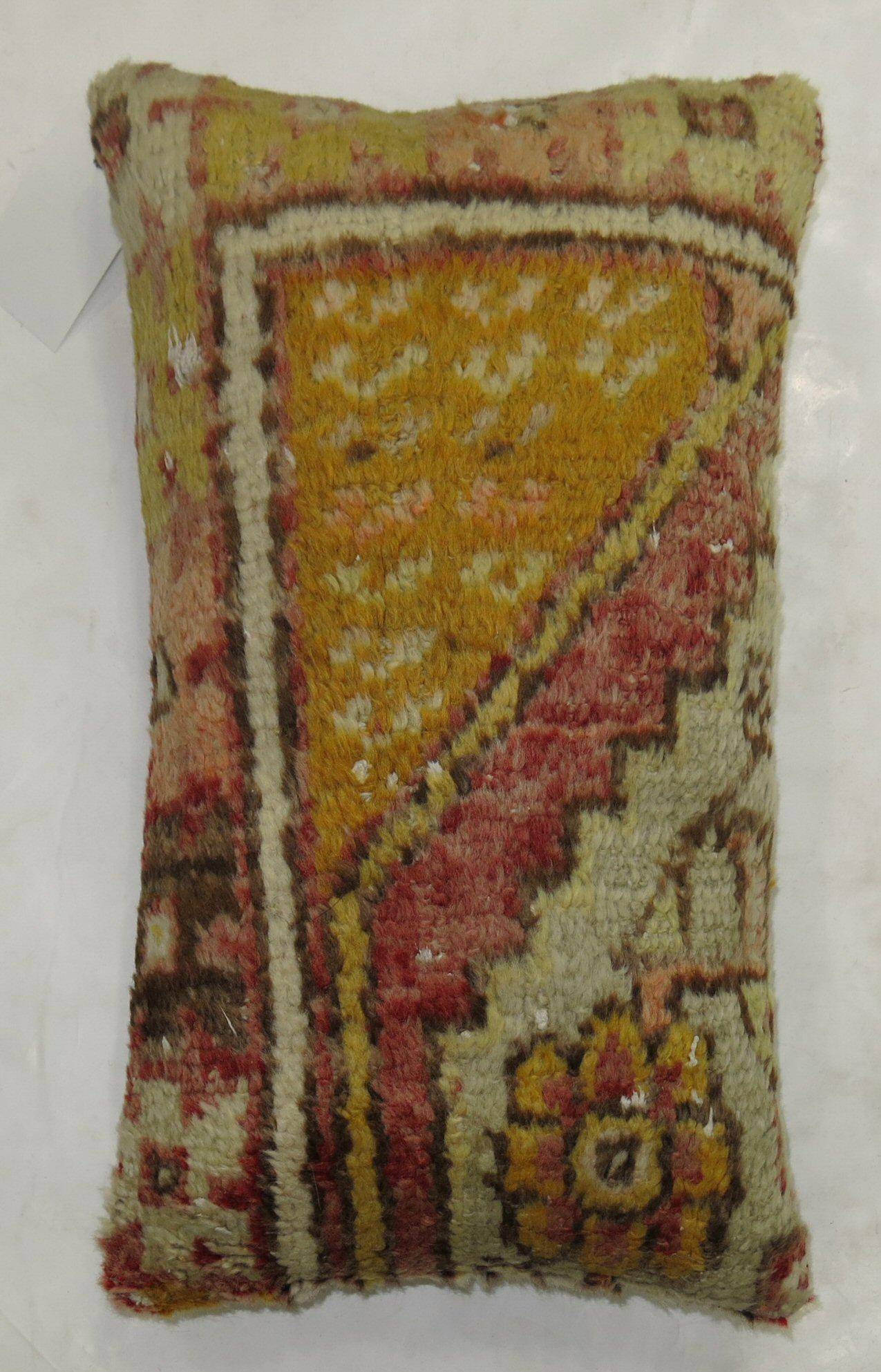 Lumbar size pillow made from a border of a tribal Turkish Anatolian rug from the 20th century

Size: 13