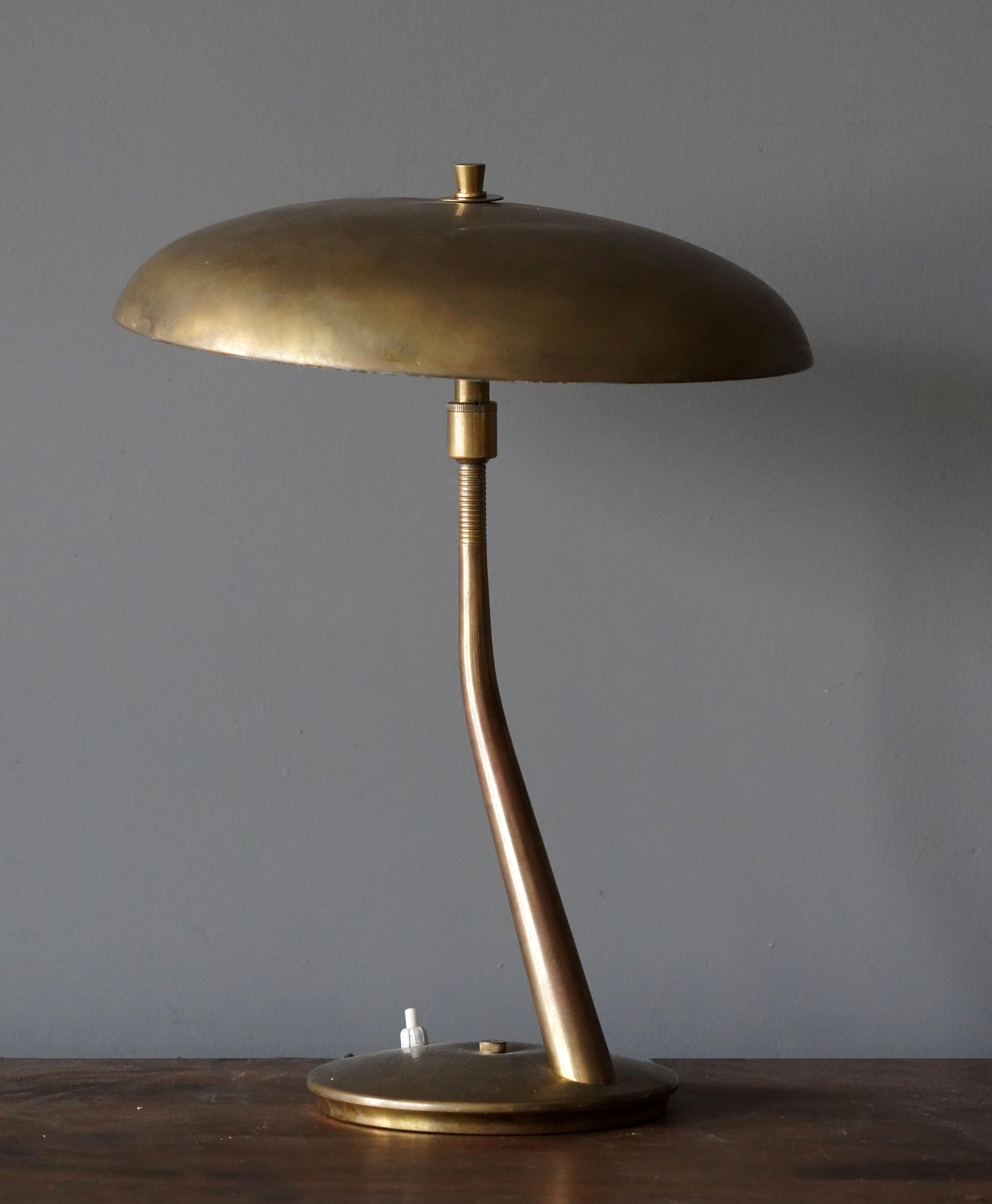An adjustable modernist table lamp / desk light produced and designed by Lumen Milano, Italy, 1950s. In brass.

Other designers of the era include Max Ingrand, Gino Sarfatti, Angelo Lelii, and Achille Castiglioni.