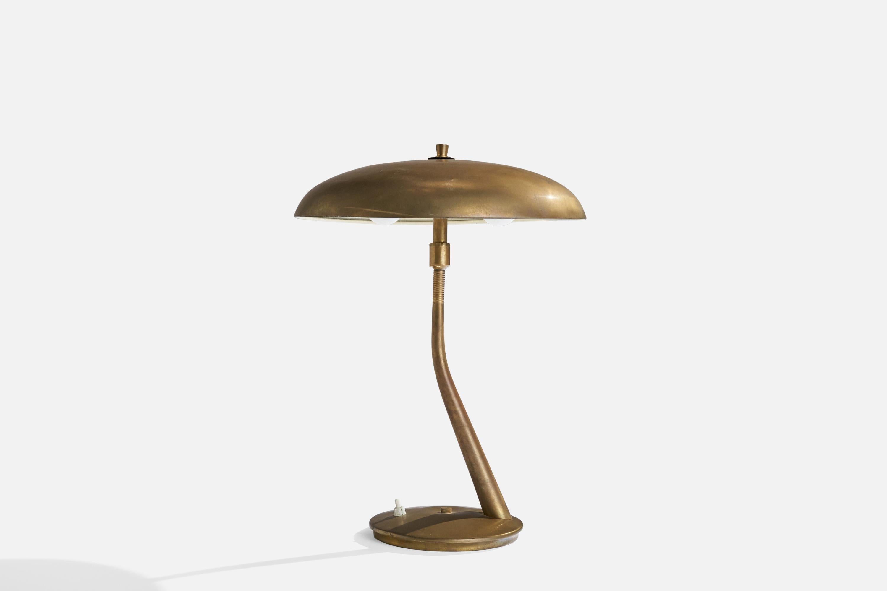 An adjustable brass table lamp designed and produced by Lumen Milano, Italy, 1950s.

Overall Dimensions (inches): 17.5” H x 12.5” D
Stated dimensions include shade.
Bulb Specifications: E-14 Bulb
Number of Sockets: 2
All lighting will be converted