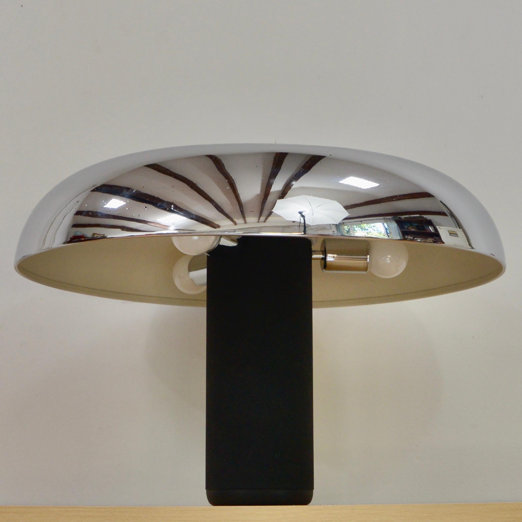 Single Lumenform table lamp from 1970s Italy. IN chrome plated aluminum and black textured steel. Fully rewired with three (3) E26 medium based sockets, ready to be used in the USA.
Measurements:
Height 15”
Diameter 21”.