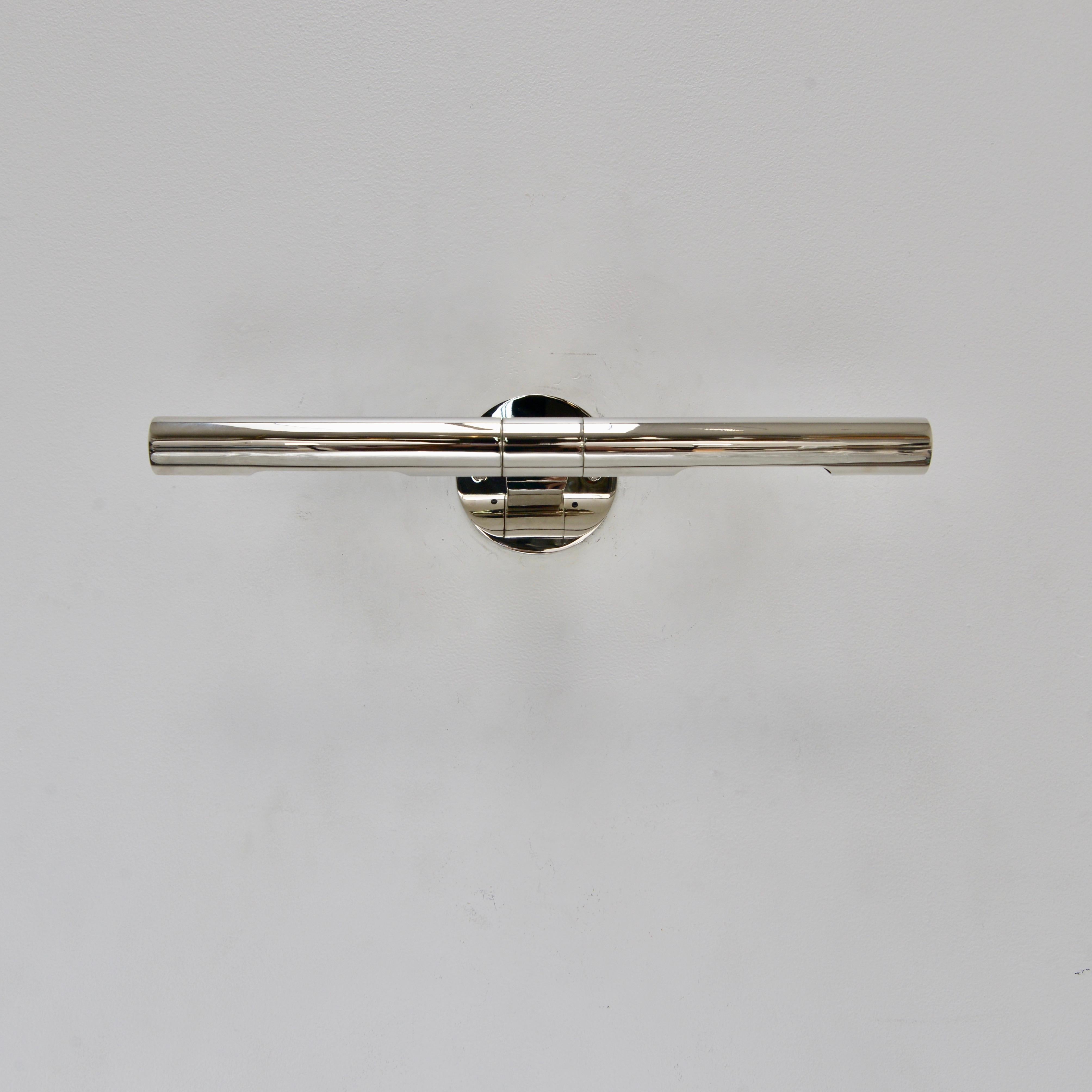 Superbly crafted linear wall sconce designed by Lumfardo Luminaires in a polished nickel finish. Sconce is designed to feature artwork and/or objects d’art. Each shade is independent and can be directed individually. Fixture comes with mounting