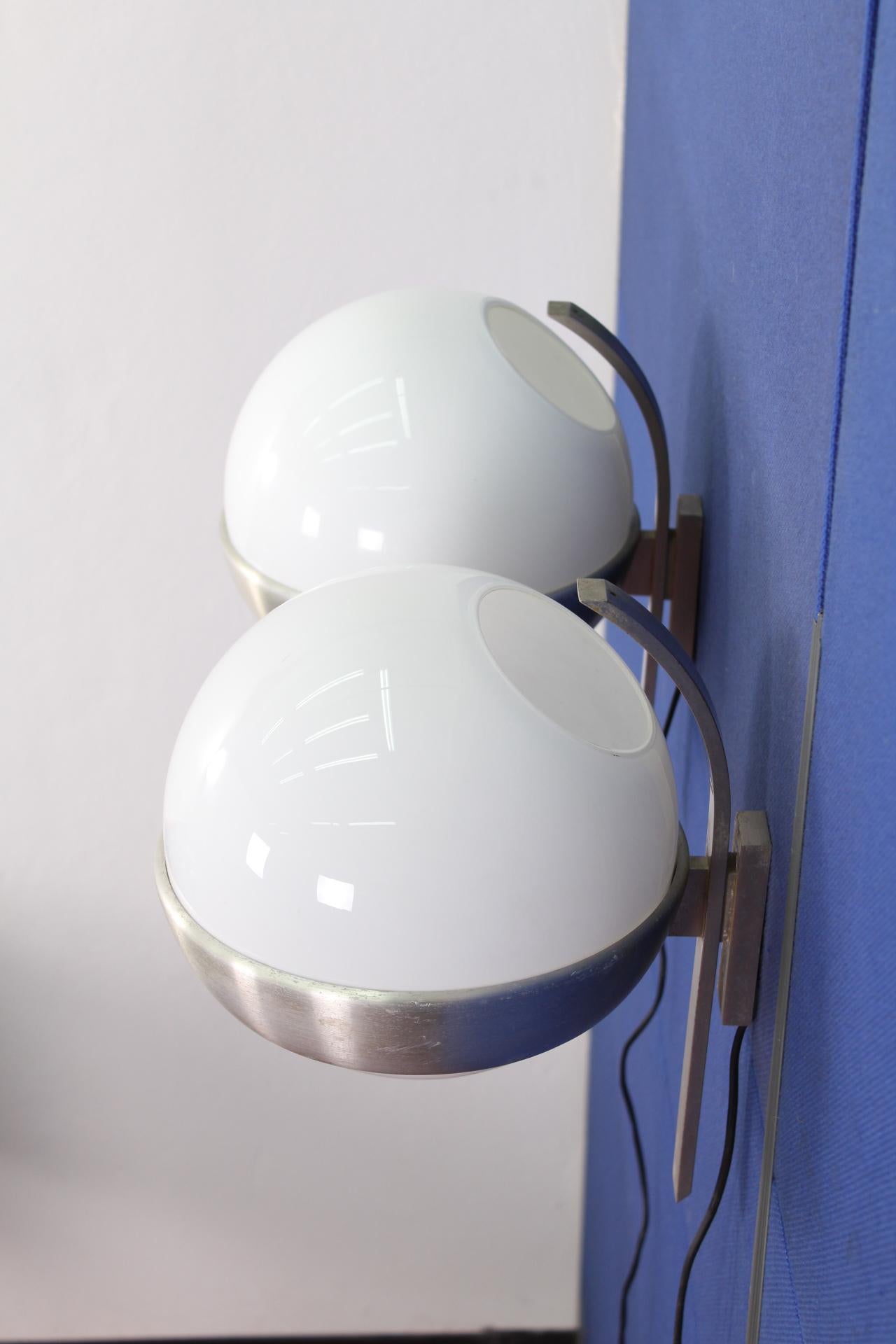 Nice pair of wall lamps produced in Italy in the 1960 by Lumi of Milano.
 Wear consistent with age and use.