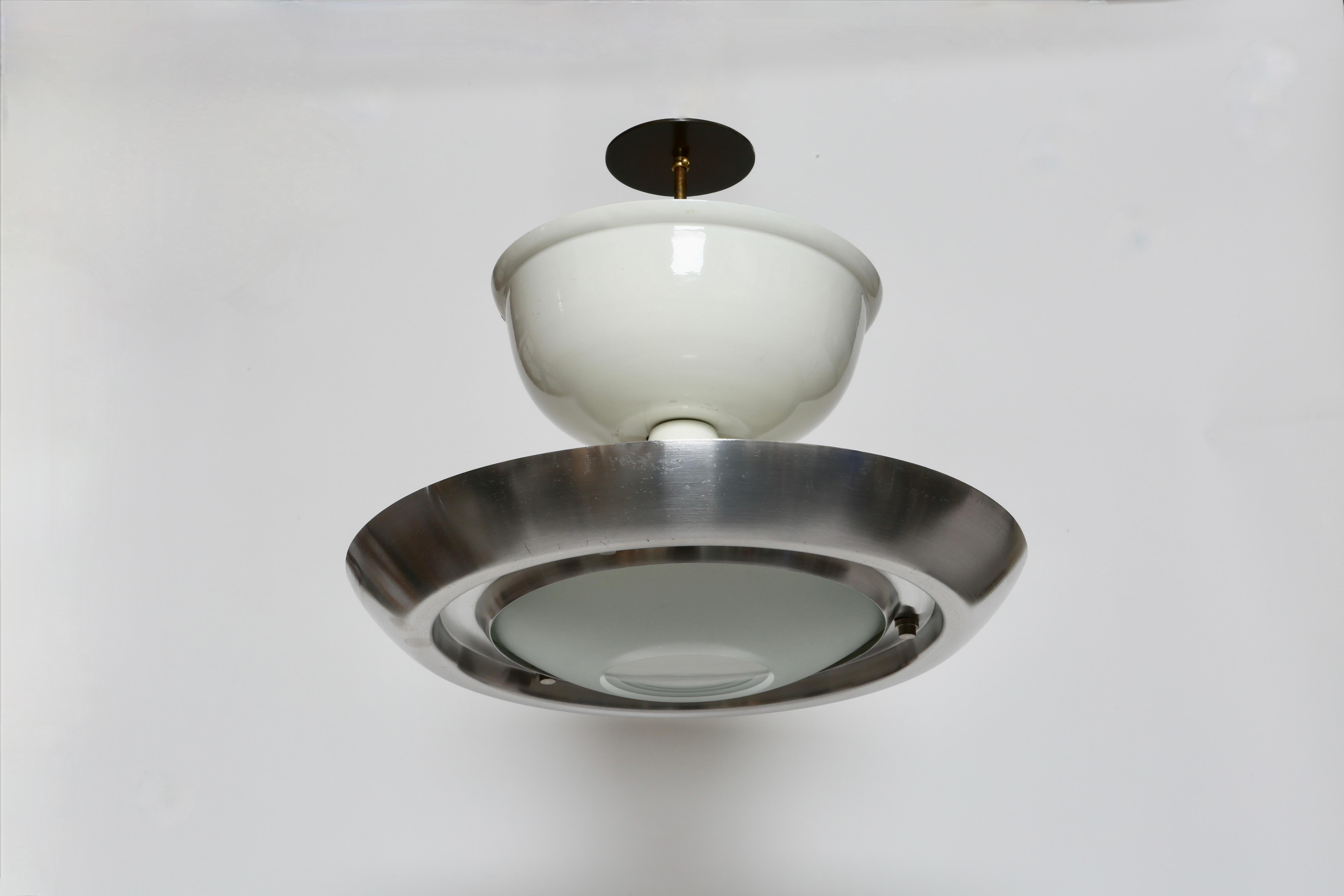 Lumi Milano ceiling suspension
Designed and made in Italy, in 1960s.
Glass, enameled metal, aluminum.
Takes 3 candelabra and 1 medium bulbs.
Complimentary US rewiring upon request
Height adjustable, ceiling rod can be made shorter or longer.
Body of