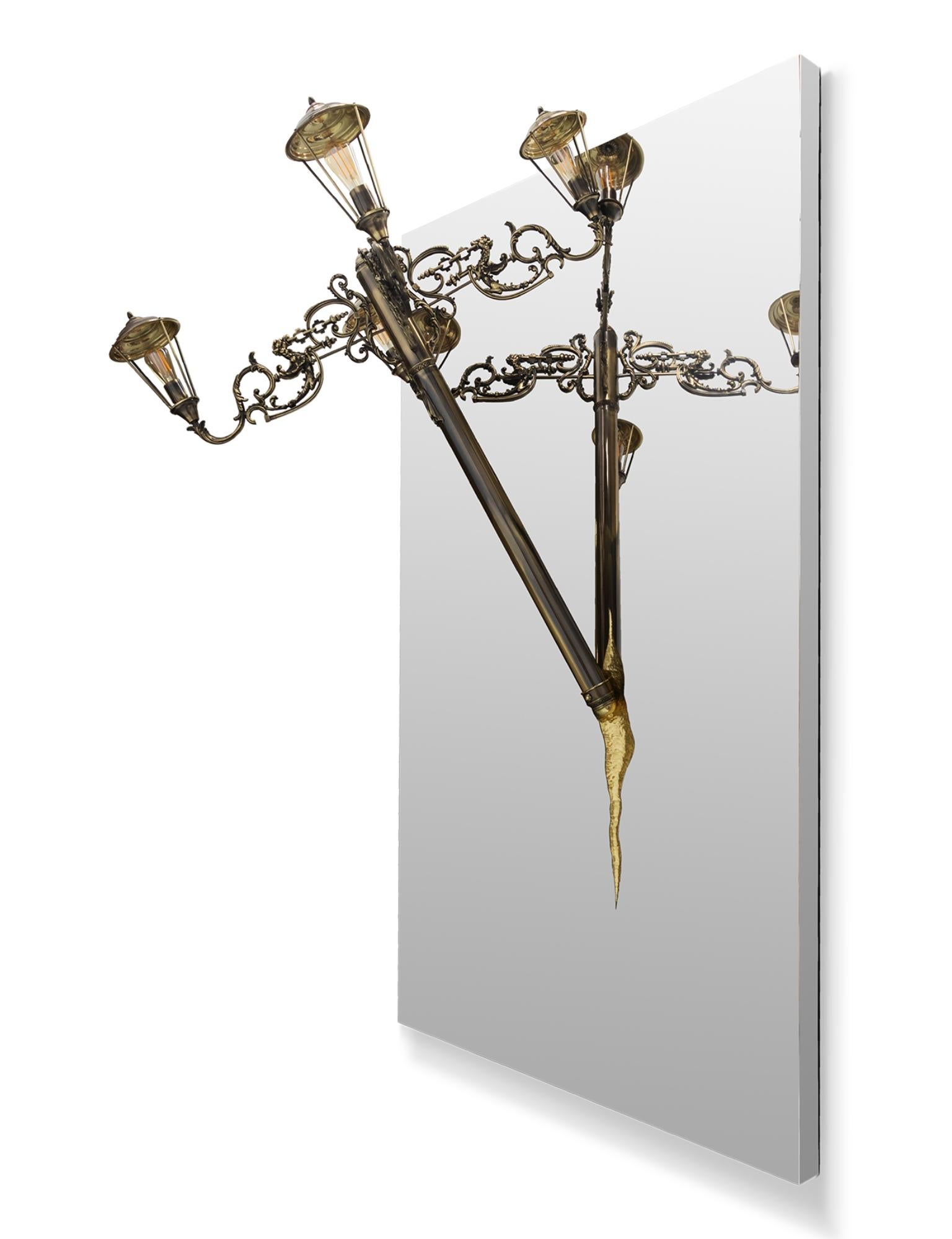 The mystic of late XIX century boulevards are brought home by the masterpiece Lumière big mirror lamp. A confluence of Victorian street lights and architectural tectonic form, the Lumière exemplifies the contemporary dualities of art and