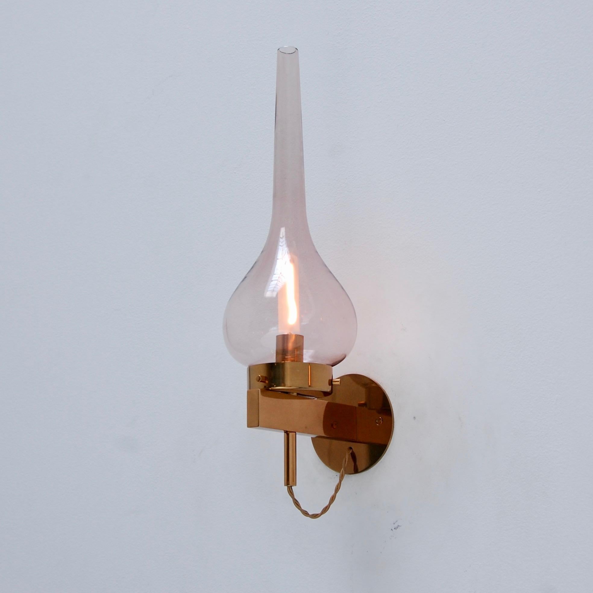 Stunning pair of rose smoked glass Lumiere sconces with beautiful polished brass hardware from the 1960s. Fully restored. Rewired for use in the US. E12 Candelabra based socket. Light bulb included. Can use round or tube shaped bulbs as shown.