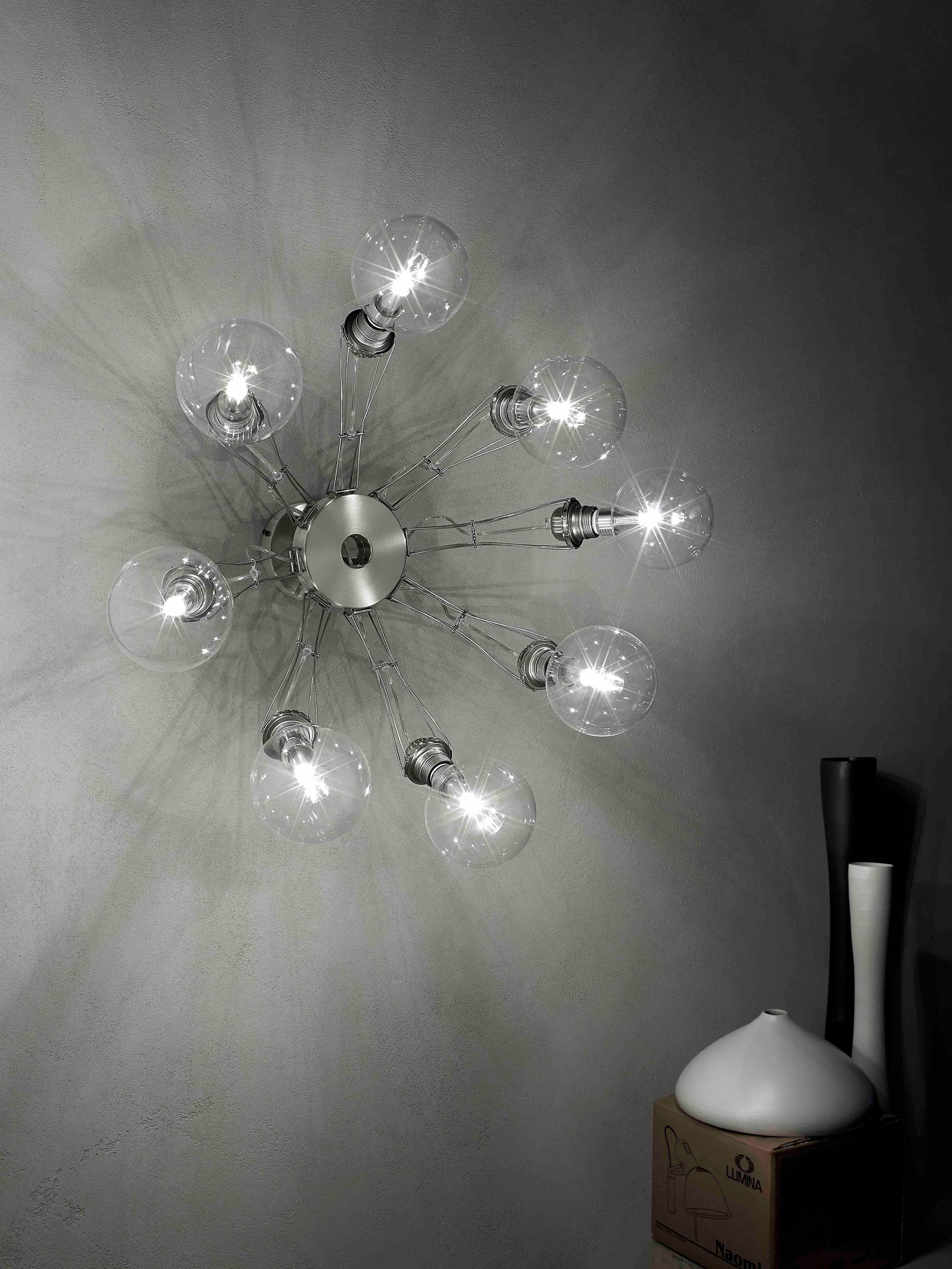 Wall-ceiling lamp in aluminium alloy and steel made of a central body with eight arms that can be moved perpendicularly to the body; halogen or fluorescent compact bulbs can be used within the maximum admitted power.
bulbs not
