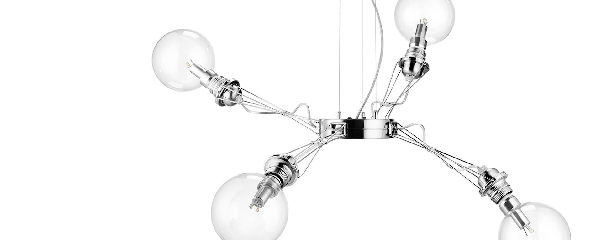 Hanging lamp in aluminum alloy and steel made of a central body with four arms that can be moved vertically; halogen or fluorescent compact bulbs can be used within the maximum admitted power.

Dimmable
With dimmable bulbs only
Source:
4 Max