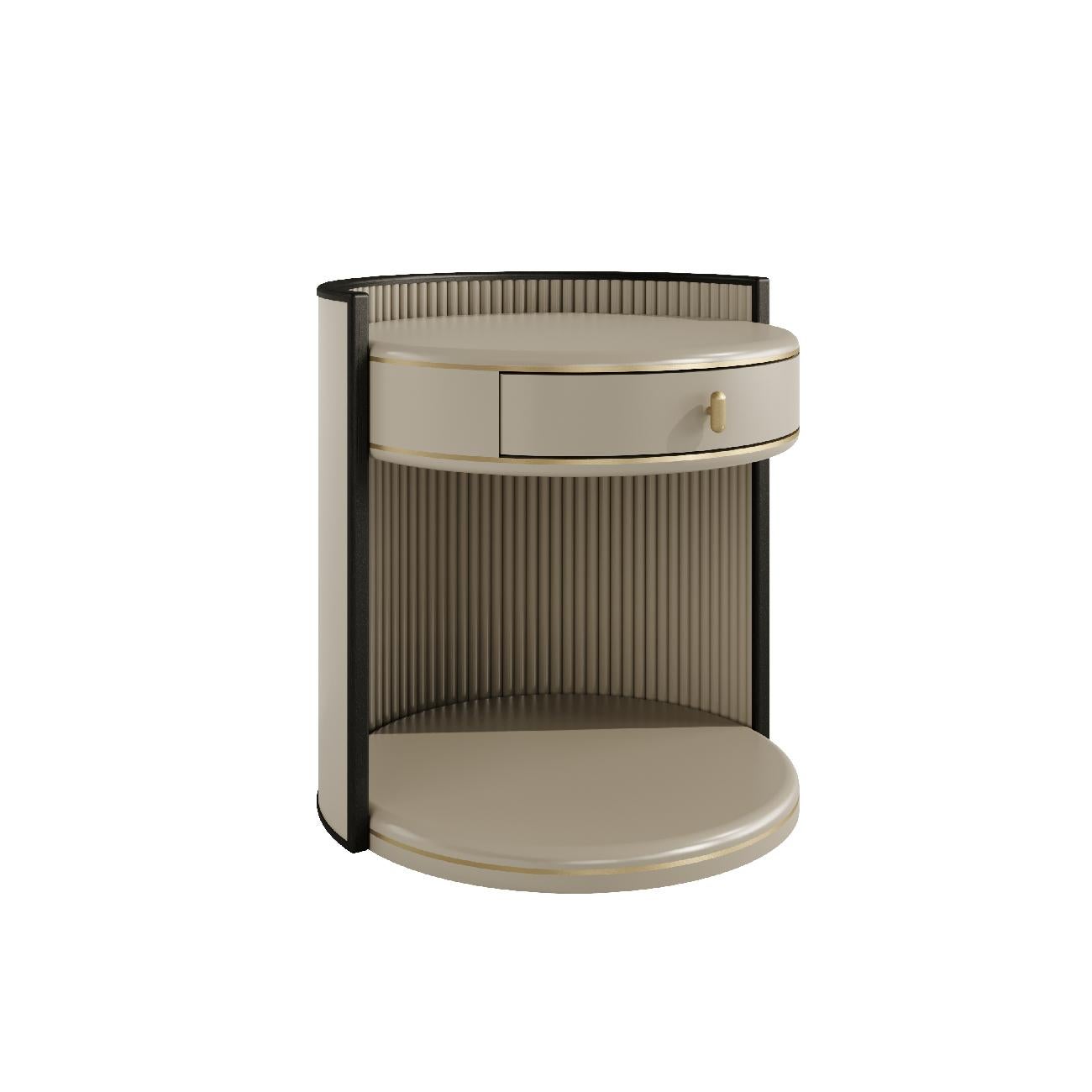The Lumina bedside table is a perfect blend of contemporary design and elegance. 

Its round top and semi-circular base with a slatted interior create a unique aesthetic. Available in lacquer or wood finishes, the table is accented with antique