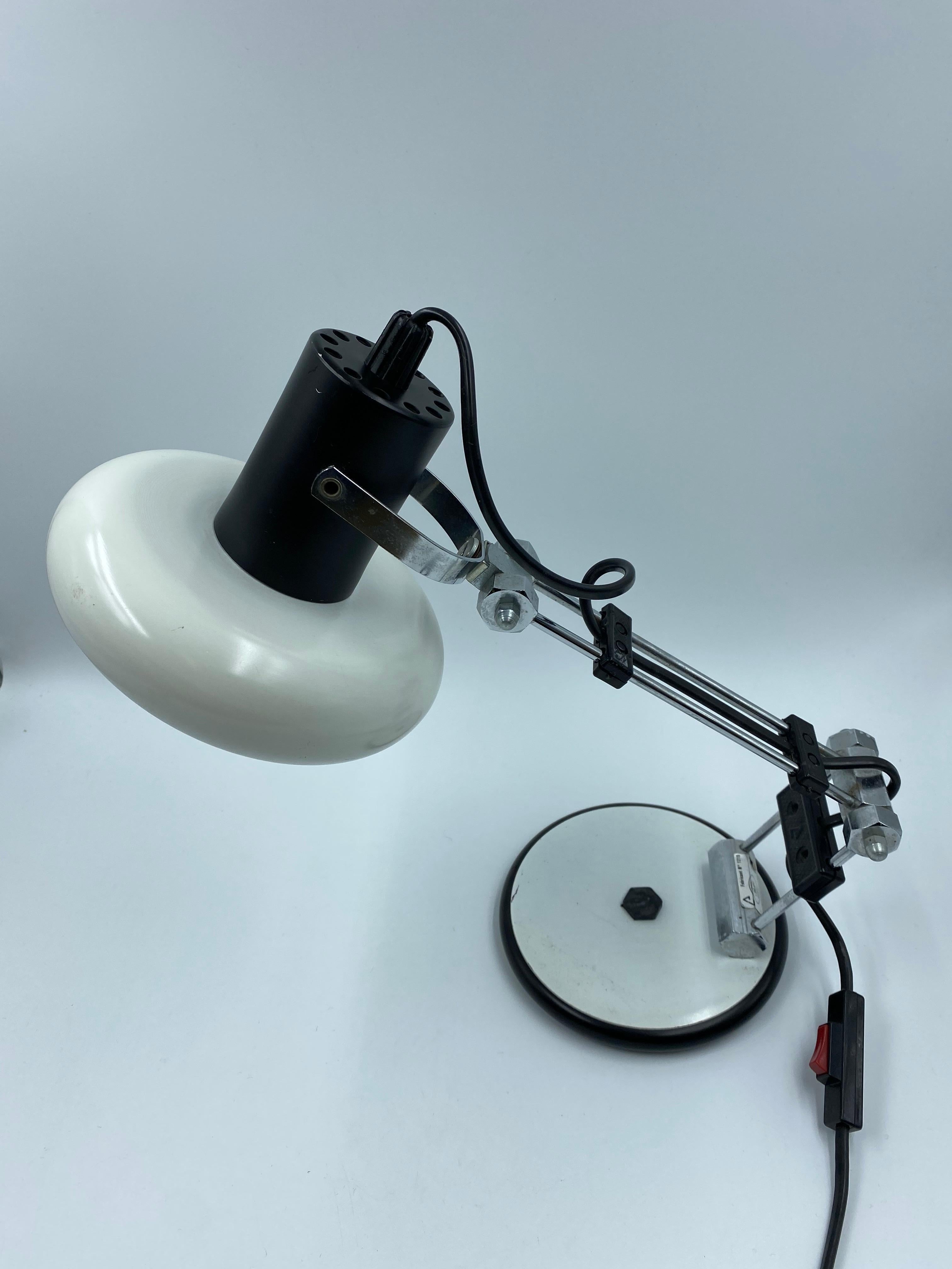 Industrial desk lamp from Luminaires NF from France. White with chrome guide rods on a heavy cast iron base. French design from the 1970s in good vintage condition. The lampshade is rotatable and can be adjusted in all positions by means of the