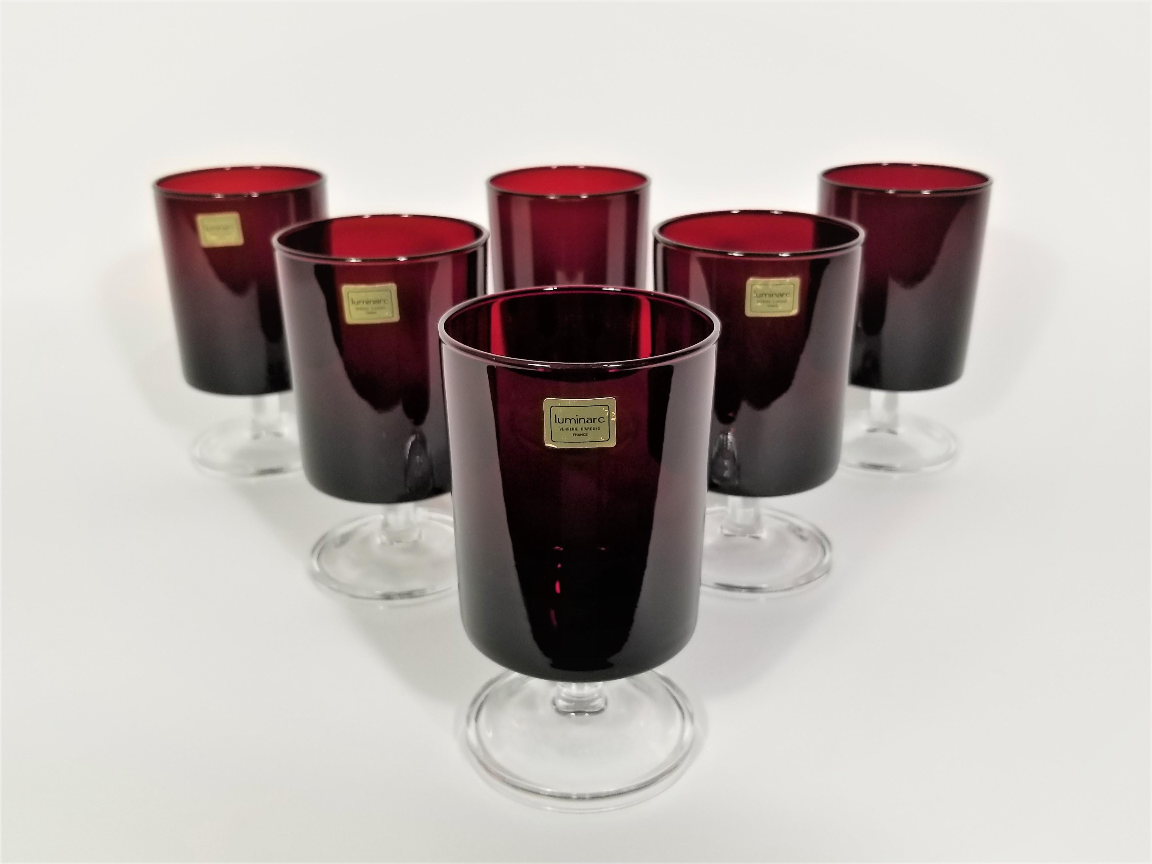 French mid century 1960s Luminarc Glassware Stemware barware. Made in France. All glasses marked France on bottom. Still retain original Luminarc marking stickers. Ruby red with clear stems. Set of 6.
