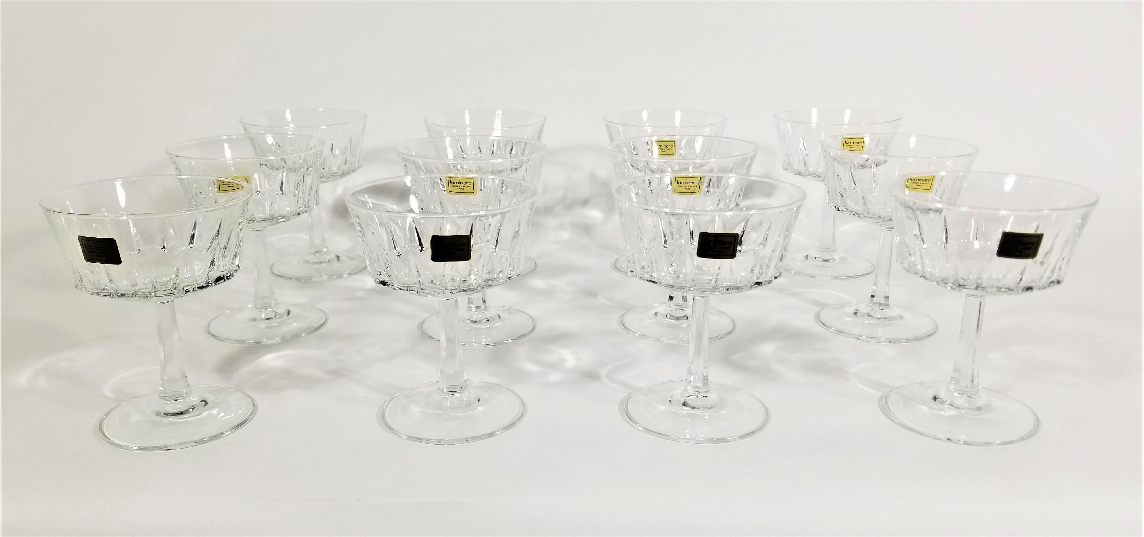 Luminarc champagne or cocktail coupes stemmed glassware barware. Mid century. All glasses marked France and most still retain original Luminarc marking sticker. Excellent Unused Condition. 



