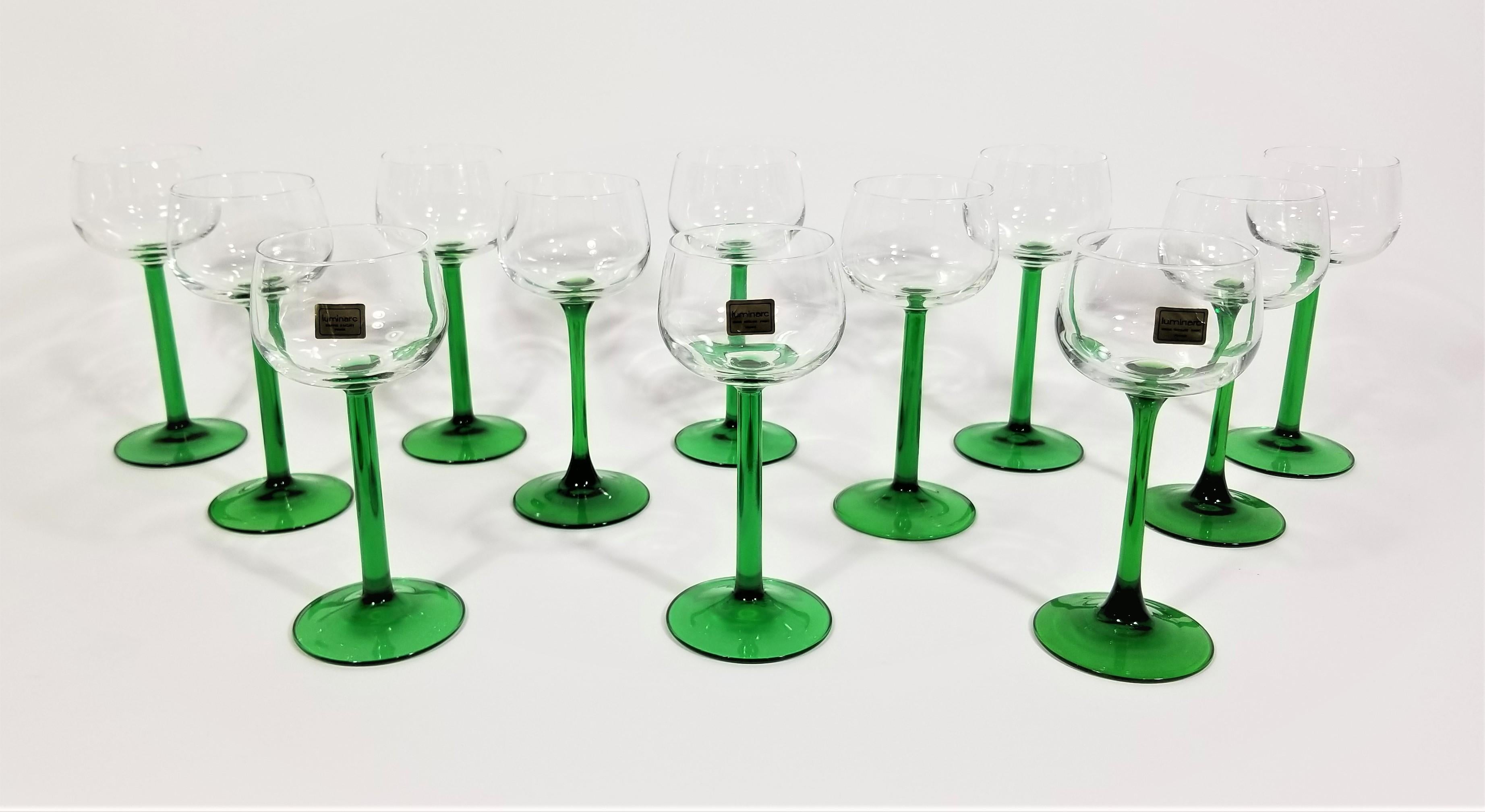 Mid century 1970s green jeweled toned French luminarc glassware barware. Tulip base. All glasses marked france. Set of 12. Excellent condition.