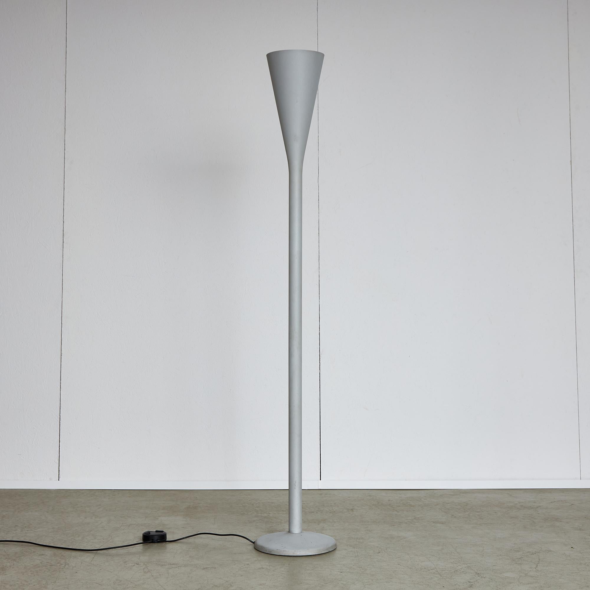 Luminator is one of the first projects that Pietro Chiesa created for Fontana Arte, in 1933. This unique floor lamp incorporates a slender metallic stem that expands into a cone, enclosing the lighting component within. Resting on a circular base,