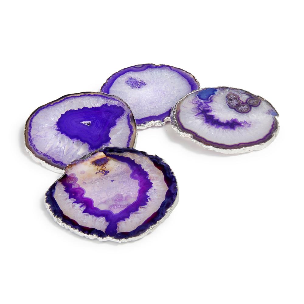 These exquisite pieces, edged in 24-karat gold, take coasters to a new level. Distinctive and unique designs, they are perfect as gifts for your favorite hosts. This is a natural product; colors and patterns may vary. Set of 4.
