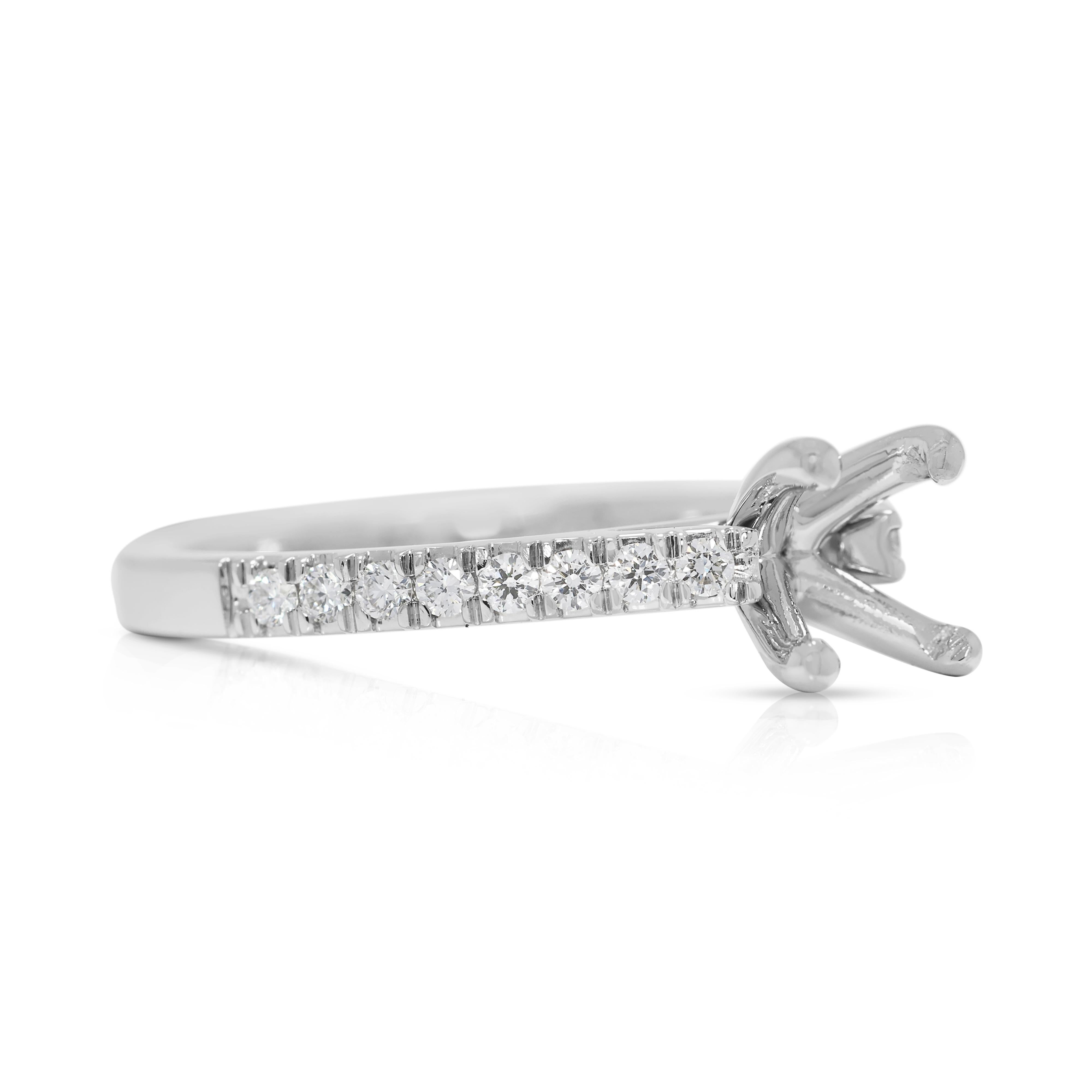 Elegance meets craftsmanship in this pre-owned platinum ring setting, designed to hold a 0.75ct to 0.90ct centerpiece diamond. Adorned with 16 round brilliant natural diamonds, totaling 0.24 carats, this piece radiates refinement and subtle