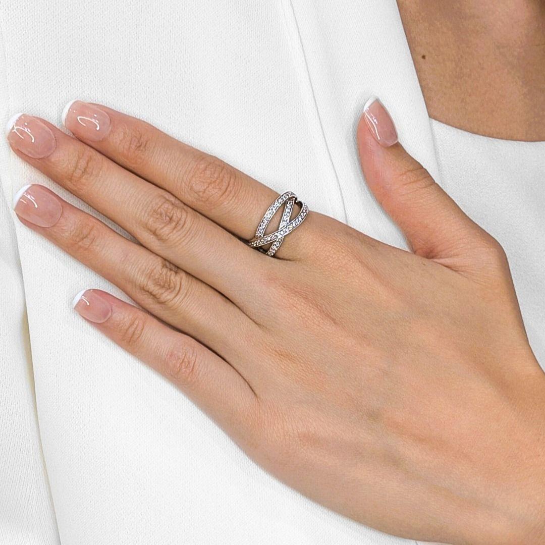This stunning crossover ring is crafted in luxurious 18K white gold, featuring a refined design with crisscrossing rows of sparkling natural diamonds. Set with 48 round brilliant diamonds totaling 0.48 carats, the stones exhibit a bright G-H color
