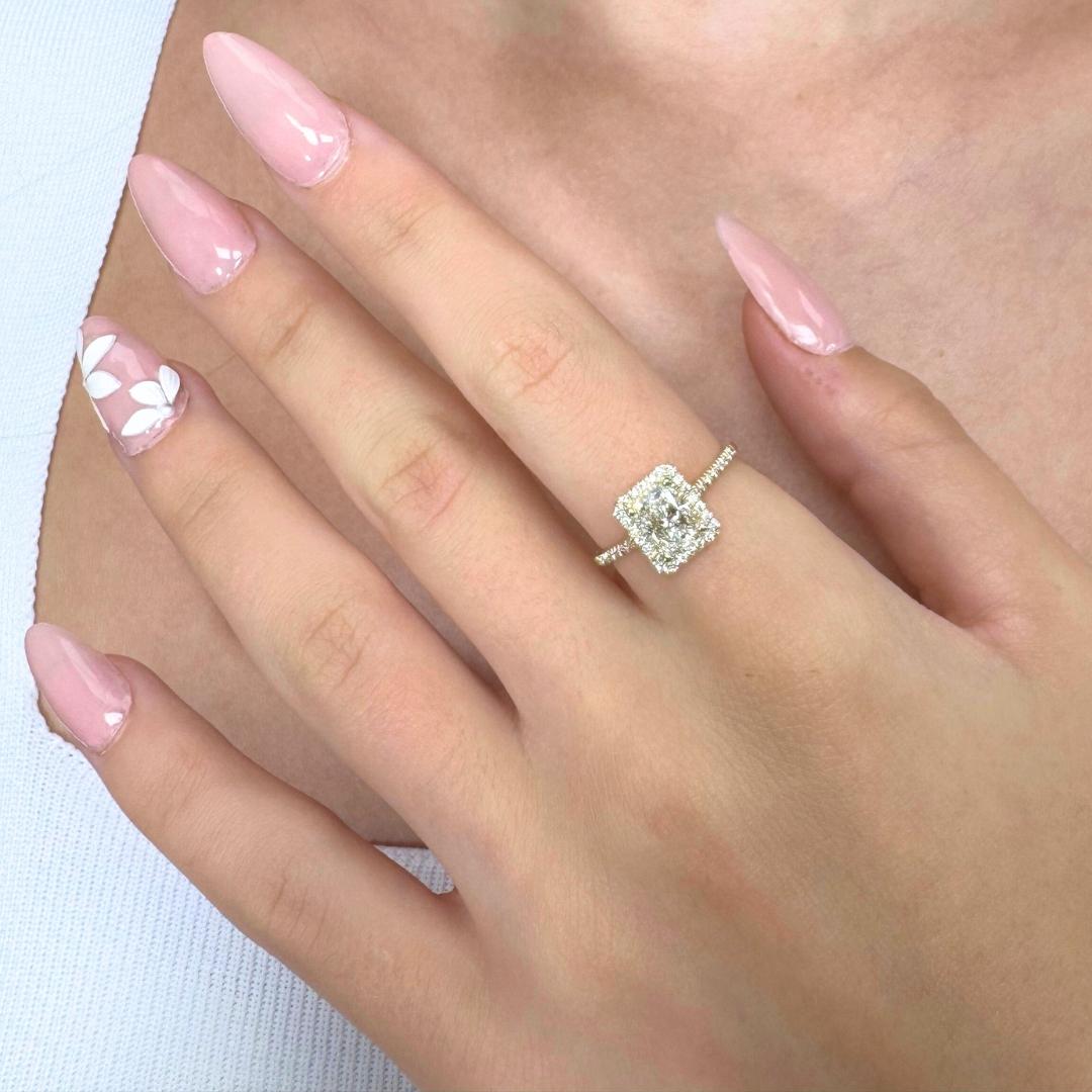 Luminous 1.22ct Diamonds Ring in 14k Yellow Gold - GIA Certified

Crafted in warm 14k yellow gold, this radiant ring features a striking 1.00ct cut-cornered rectangular diamond. Surrounding the centerpiece are 40 brilliant round diamonds with a