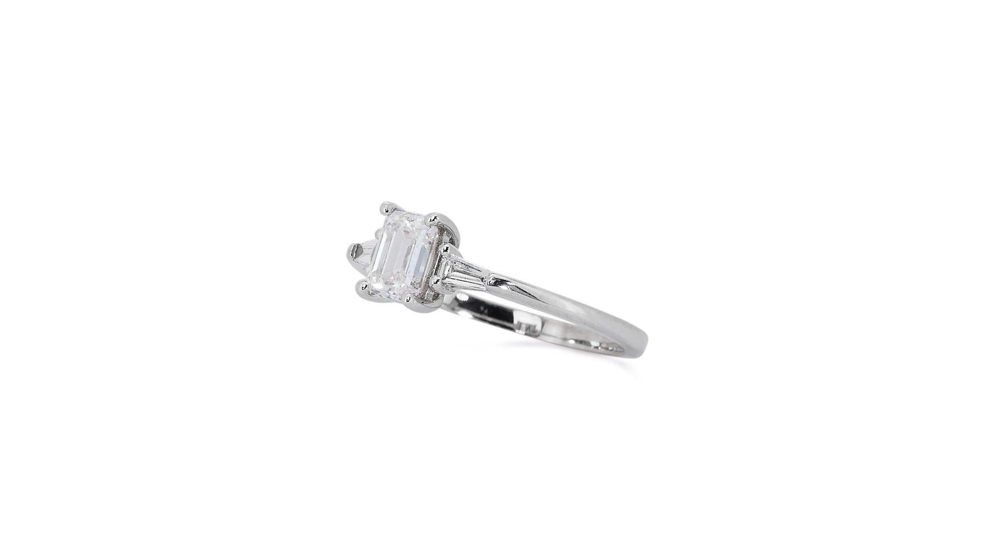 Luminous 1.28ct Diamonds 3-Stone Ring in 18k White Gold - GIA Certified

Indulge in the timeless beauty of this stunning diamond 3-stone ring. Crafted from luxurious 18k white gold, the ring features a captivating 1.00-carat emerald-cut diamond as