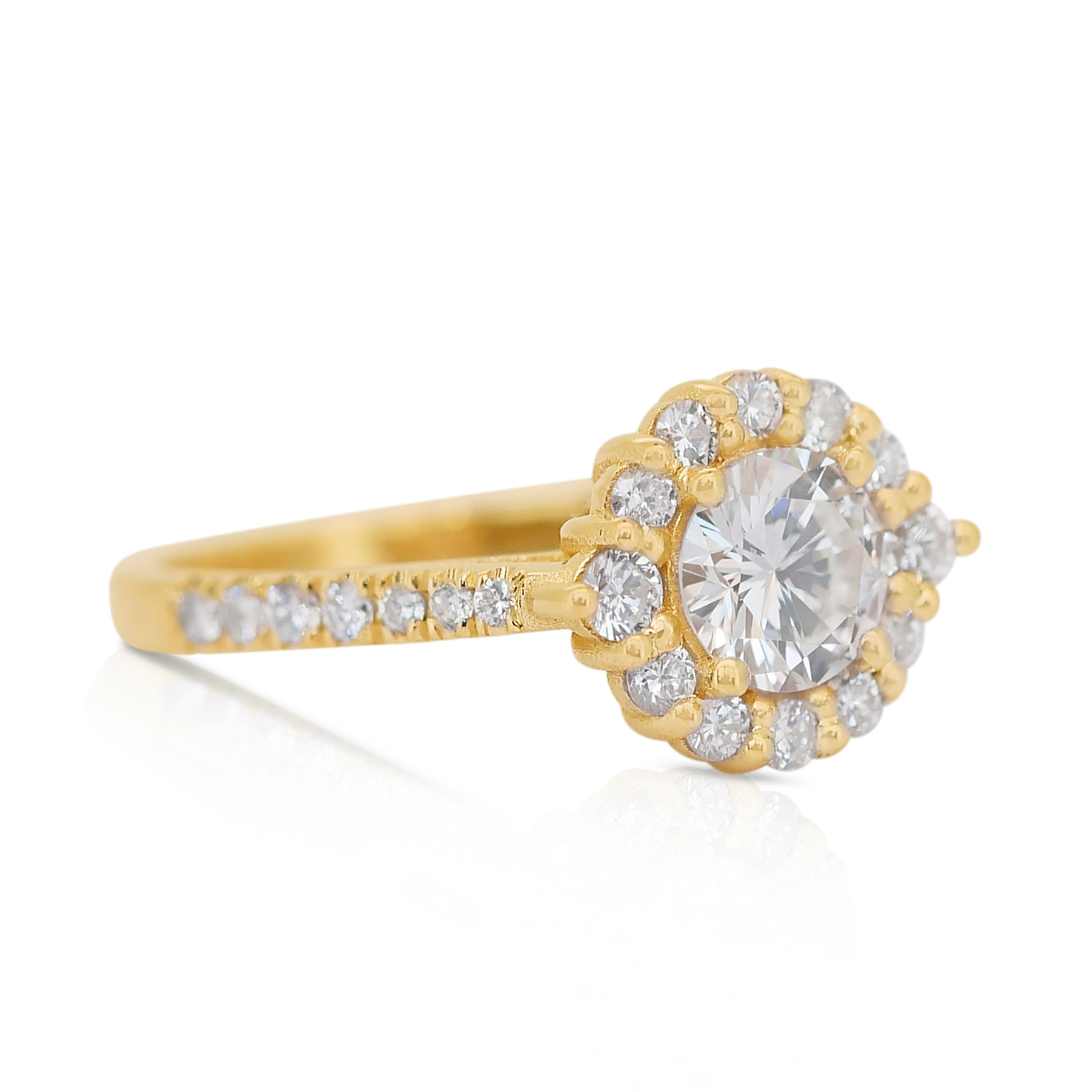 Luminous 1.36ct Diamonds Halo Ring in 18k Yellow Gold - IGI Certified

This sophisticated 18k yellow gold halo ring showcases a brilliant 0.80-carat round diamond at its center. Surrounding the center stone are 26 round diamonds totaling 0.56-carat,
