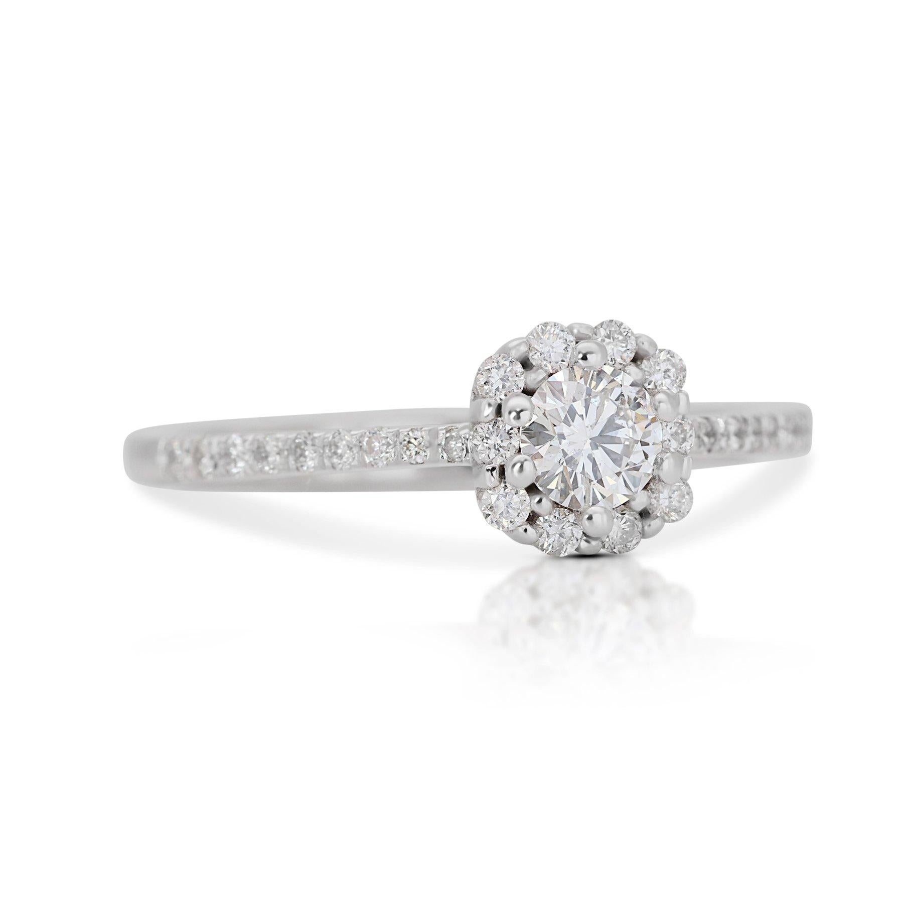 Luminous 14K White Gold Natural Diamond Halo Ring w/1.35ct

Introducing our stunning Round Brilliant Ideal Cut Diamond Ring, a timeless symbol of everlasting love and sophistication. At the heart of this exquisite ring lies a dazzling 0.70 carat