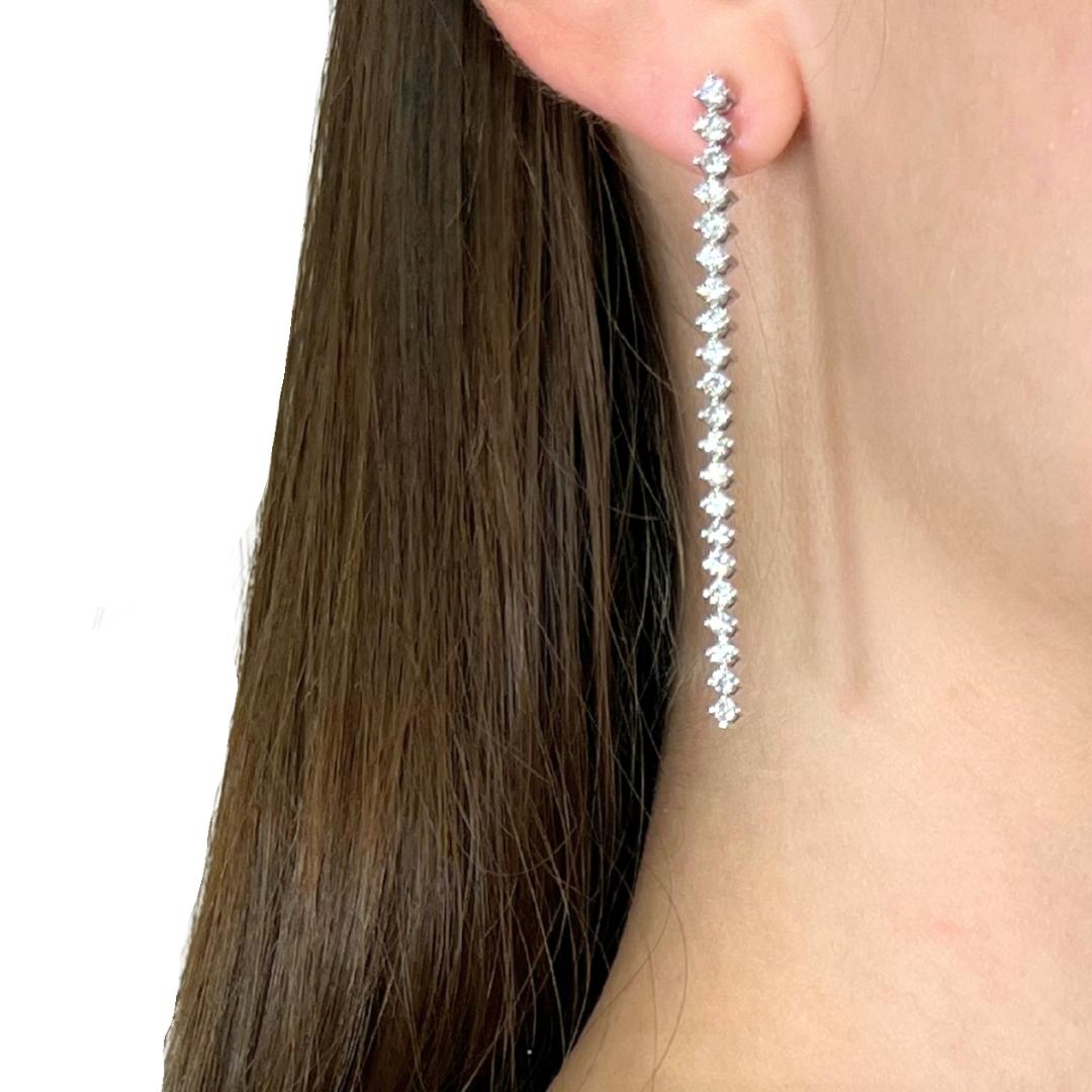 Luminous 2.42ct Diamonds Drop Earrings in 18k White Gold - IGI Certified

These 18k white gold drop earrings are a dazzling showcase of refined sparkle and timeless design. Set with 42 round diamonds totaling 2.42ct, it offers a brilliant balance of