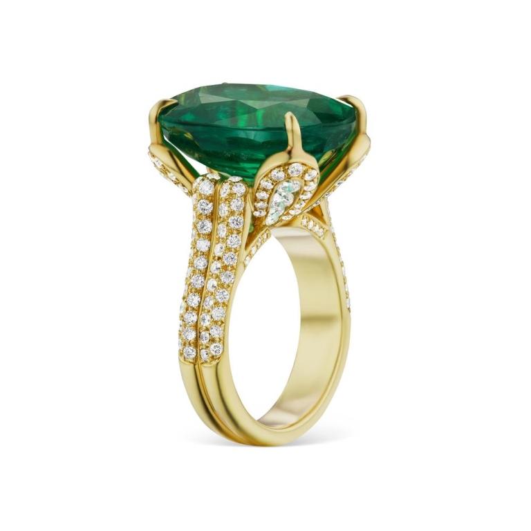 LUMINOUS EMERALD OVAL RING A rich green Emerald sits delicately in a 4 prong setting. Surrounding this beautiful 14 ct. stone are glimmering white diamonds set in 18K Yellow Gold. Item: # 01896 Metal: 18k Y Lab: Gia Color Weight: 14.69 ct. Diamond