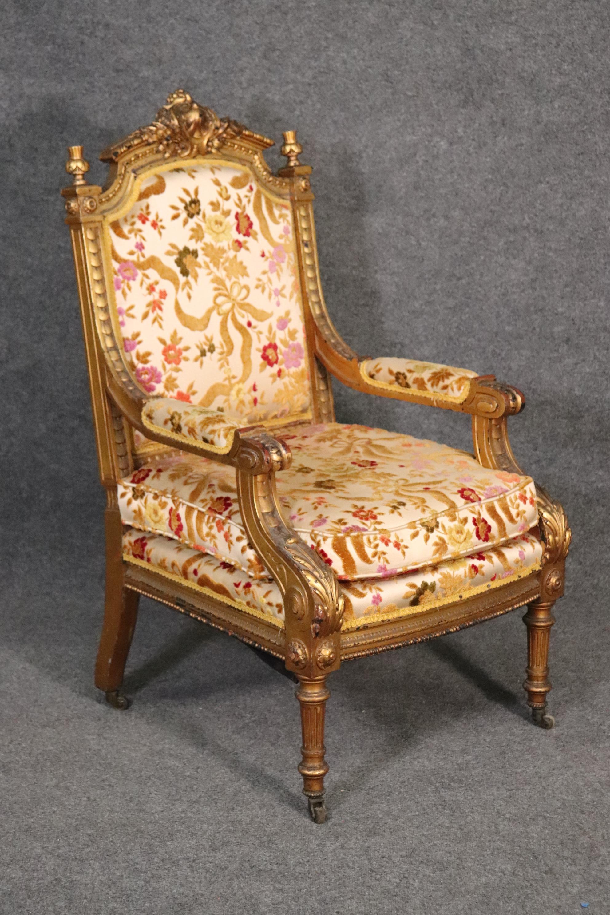 This is a gorgeous gilded French armchair that can easily add some sorely needed character to a corner of a room or next to a neutral sofa or settee. The chair is beautifully made and in it's original upholstery and gilded gold leaf finish. The