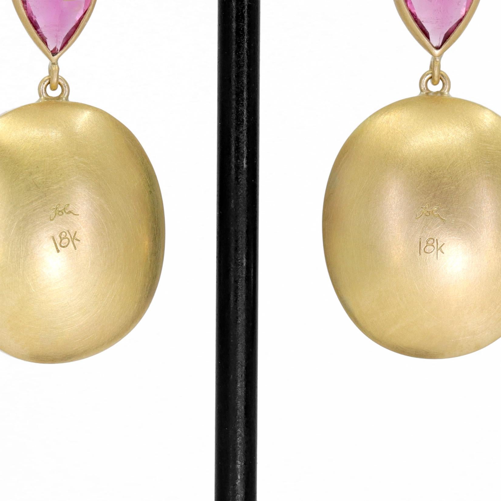 One of a Kind Drop Earrings by award-winning jewelry maker Lola Brooks, hand-fabricated in her signature-finished 18k yellow gold showcasing a gorgeous matched pair of shimmering round bi-color blue/pink indicolite tourmaline cabochons totaling