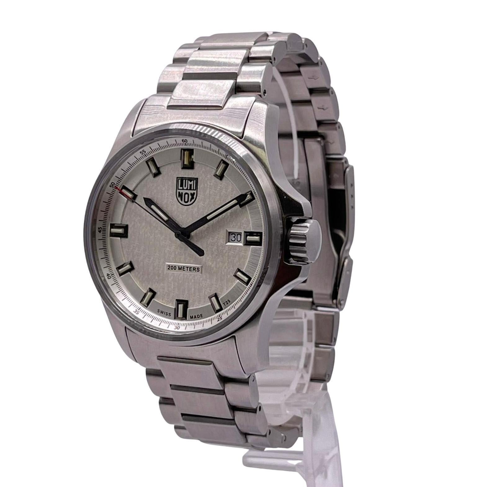 Unworn Luminox Dress Field Men's Watch XL.1839. This Beautiful Timepiece is Powered by Quartz (Battery) Movement and has Stainless Steel Case and Bracelet, Silver Dial with Luminous Silver-Tone Hands and Stick Hour Markers. Date Display Set at the 3
