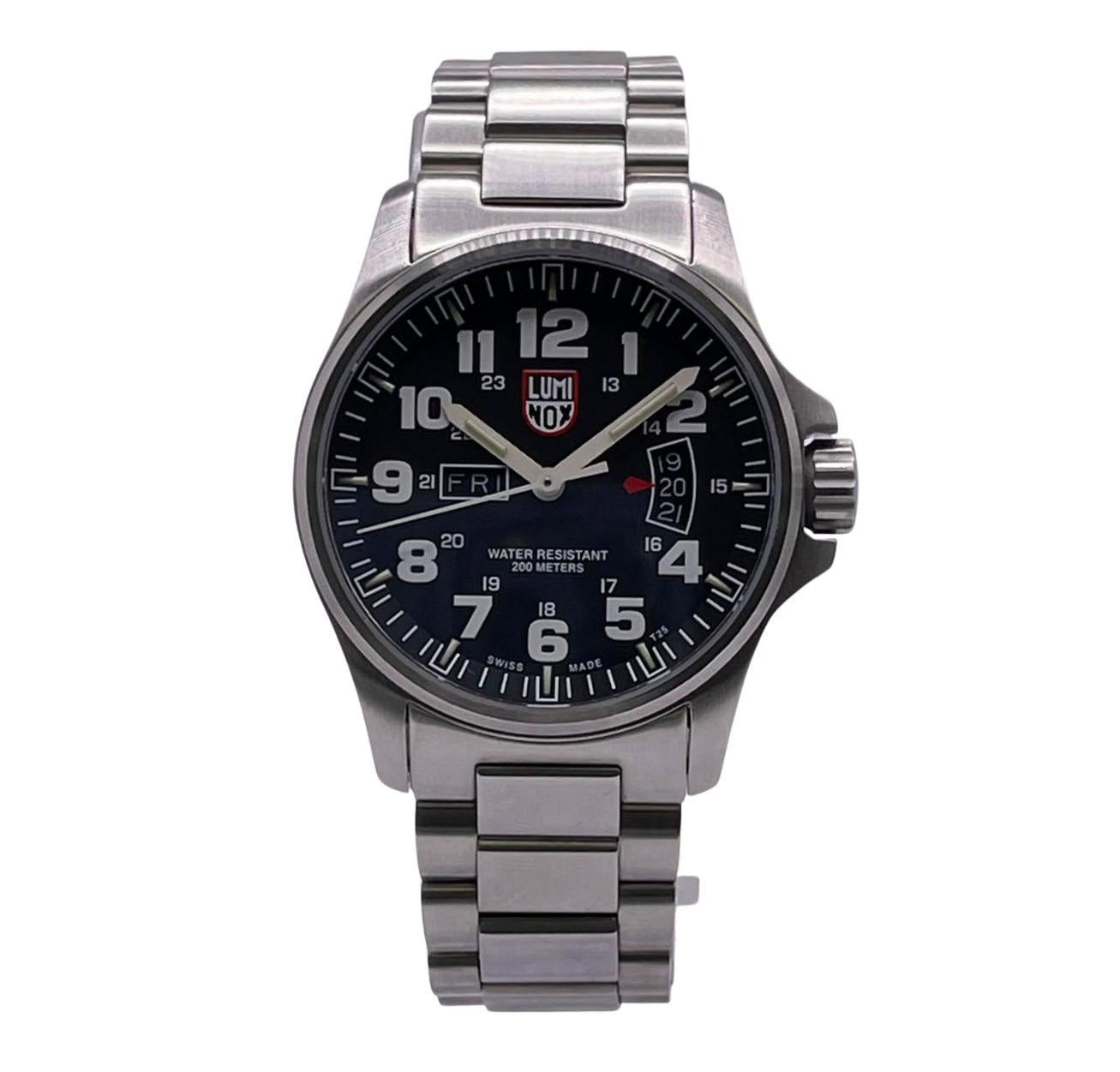 Unworn Luminox Field Day Date Men's Watch XS.1822. This Timepiece is powered by Quartz (battery) movement with features: Stainless Steel and a bracelet. Black Dial with white luminous hands and white Arabic numeral markers. Date and Day window