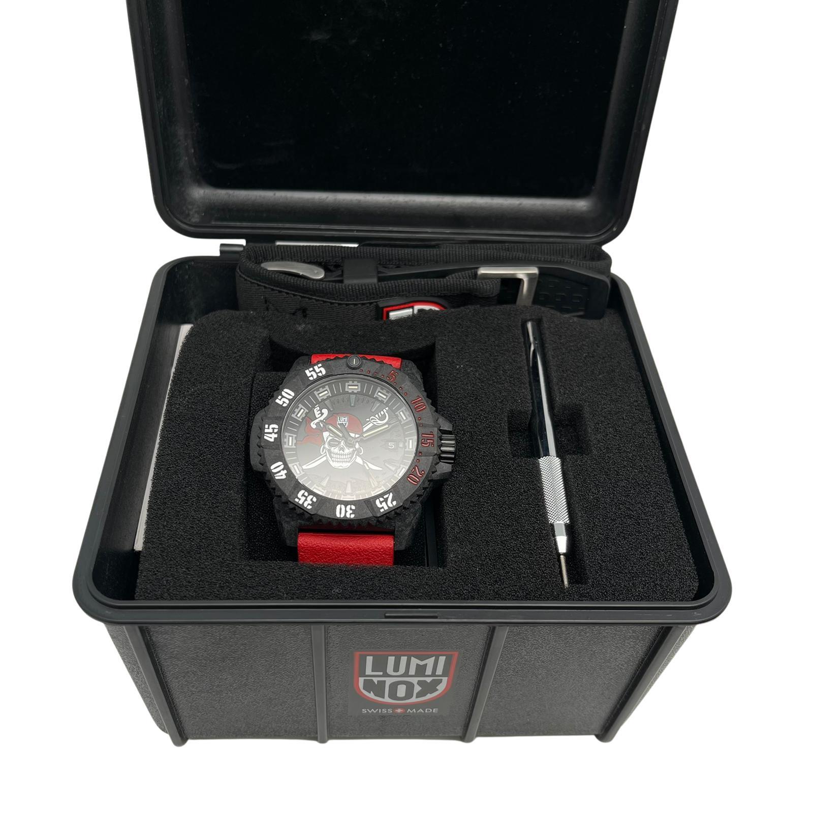 Unworn Luminox Jolly Roger Limited Edition 46mm Black Dial Men's Quartz Watch 3801.JR.SET. This Timepiece is powered by Quartz (battery) movement with features: Carbon case and Red Rubber two-piece  Straps. Unidirectional rotating bezel with minute