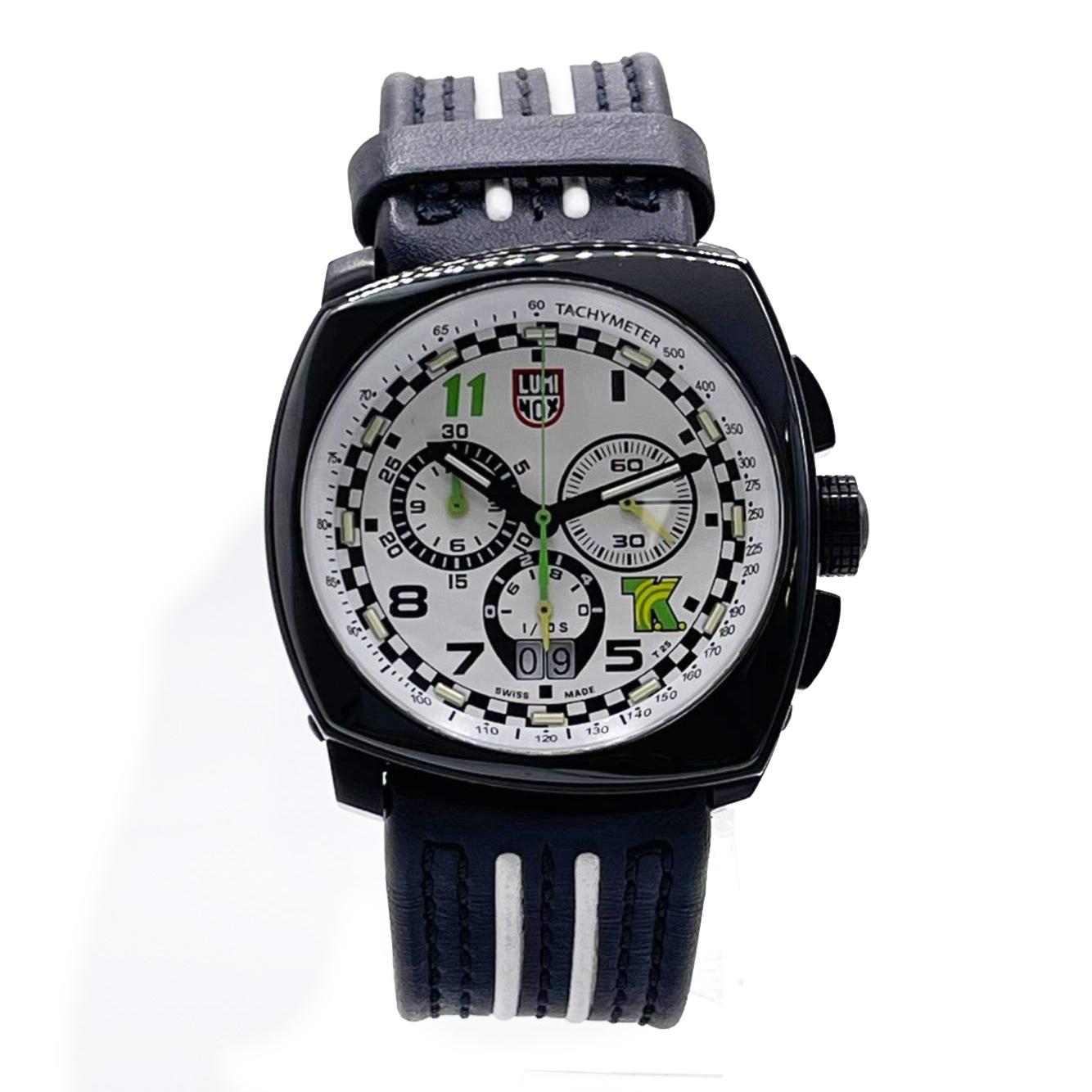 Display Model Luminox Tony Kanaan Men's Watch XL.1146. May Have Minor marks on the Case From Storing. This Beautiful Timepiece is Powered by Quartz (Battery) Movement and Features: Stainless Steel Case with Carbon Fiber, Black and White Leather