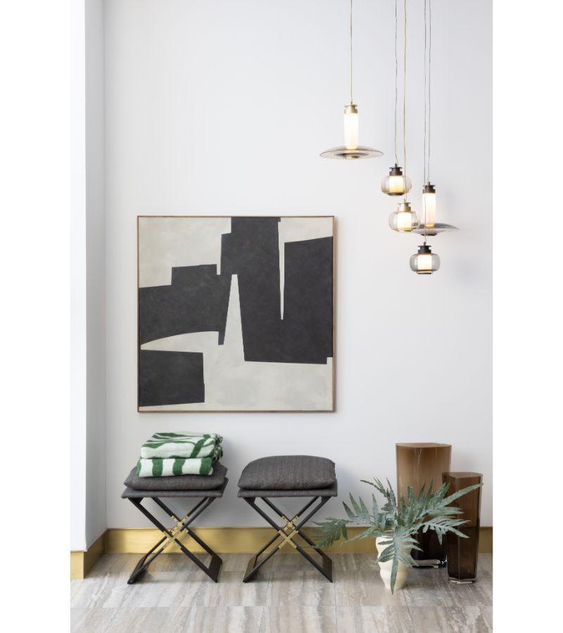 Highlighting the beauty of blown glass, the Luna A Small Disc Pendant stands out by its simplicity and elegance. Also available in black hardware with smoked glass and brass hardware with bronze glass, all Luna A Pendants are provided with an 8 foot