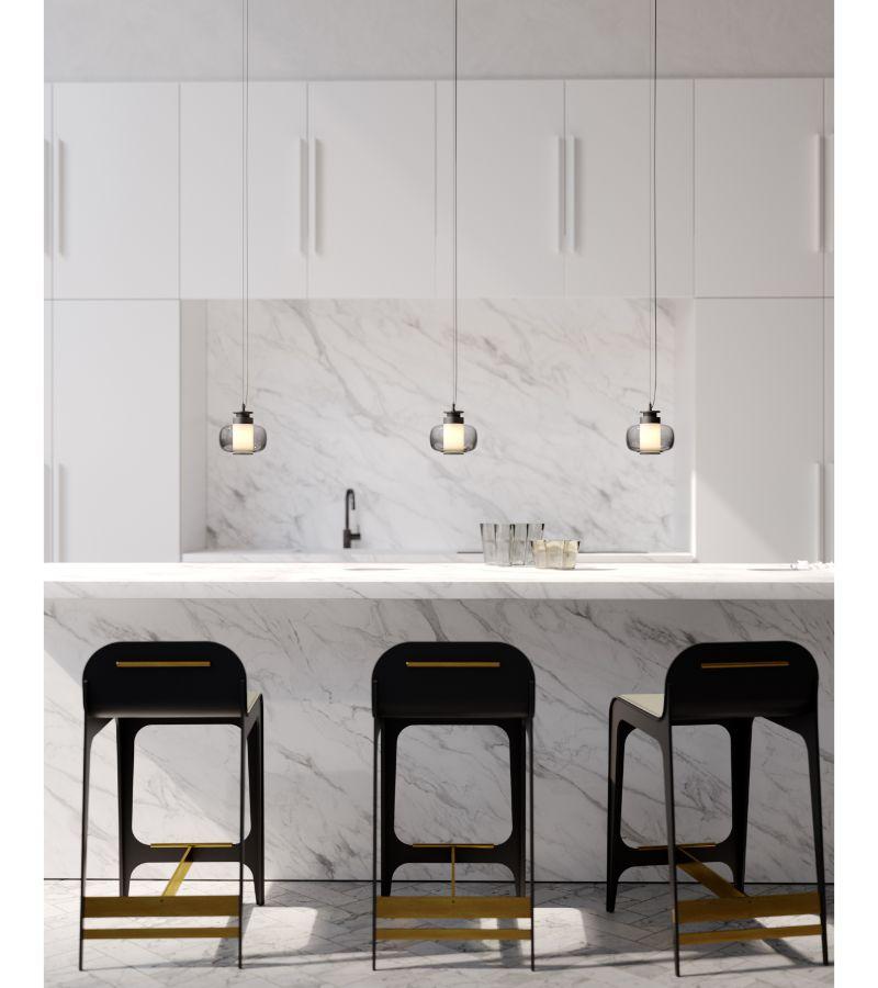 Highlighting the beauty of blown glass, the Luna A X-Small Pendant stands out by its simplicity and elegance. Also available in black hardware with smoked glass and brass hardware with bronze glass, all Luna A Pendants are provided with an 8 foot