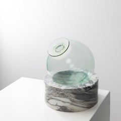 “Luna” Blown glass vase resting on a marble base by Ettore Sottsass