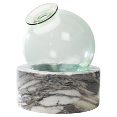 “Luna” Blown glass vase resting on a marble base by Ettore Sottsass