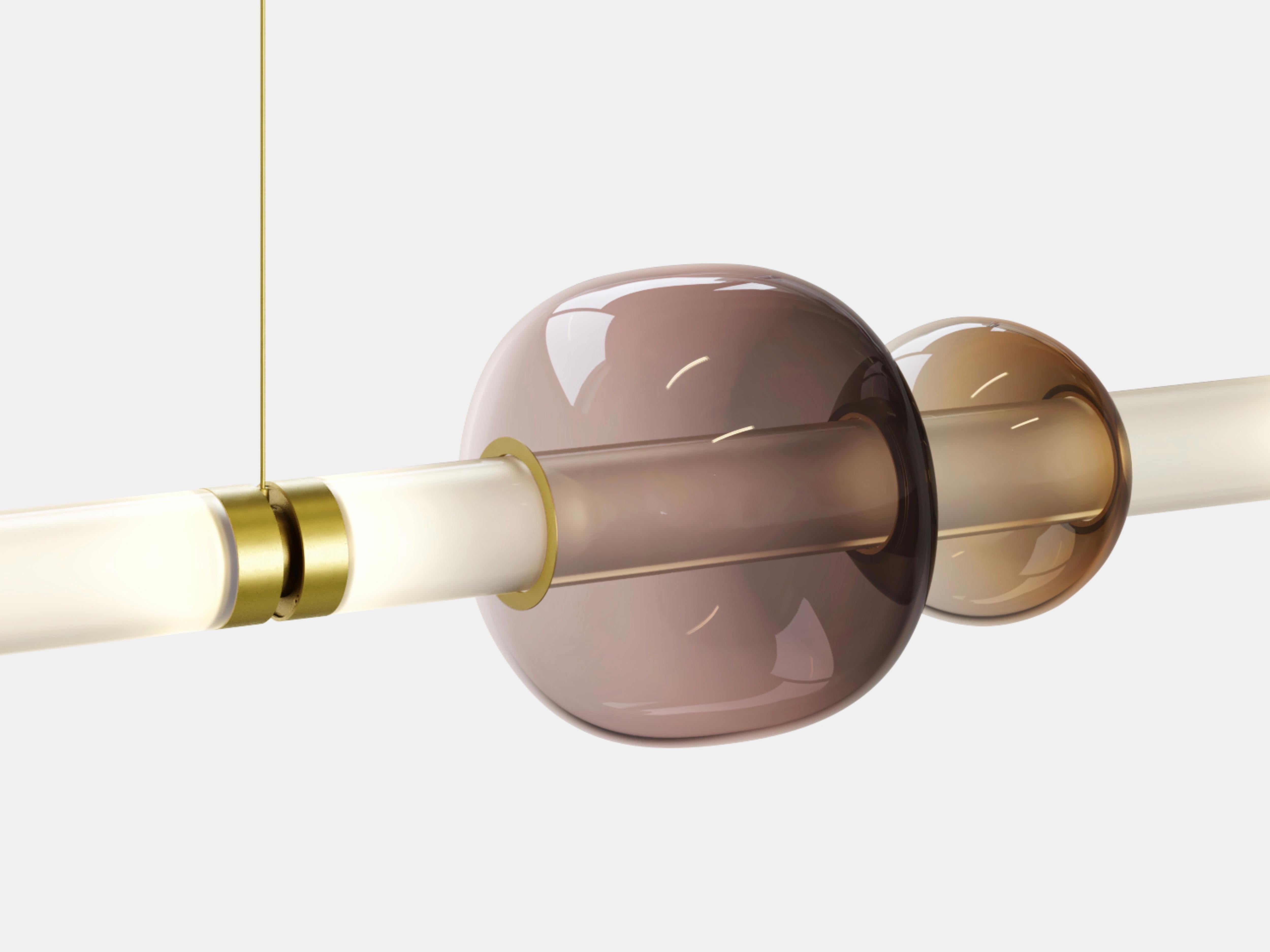 A lighting system with infinite interpretations, the Luna Chandelier 1 Tier  is a synergy of color, shape, and refracted light. Inspired by a lunar halo, the modular light fixture grows in every direction as its assembly system stems horizontally or
