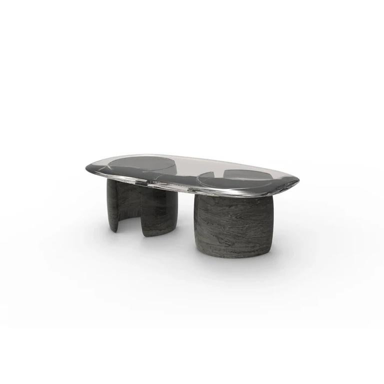 The Essentia Home Luna Coffee Table is a work of art, merging smooth curves with sleek materials. Having a glass top that can be customized, the table captures light and dimension, offering an exciting visual play. The metal sculptural base with a