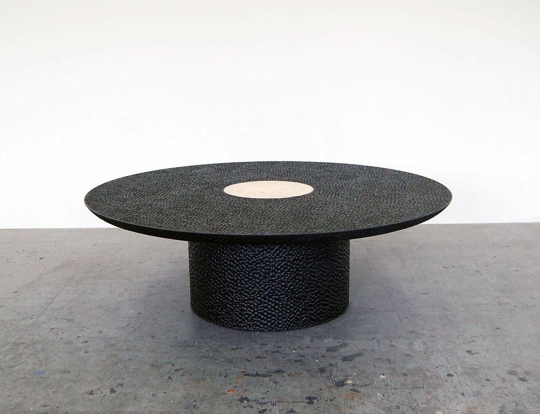 Luna coffee table sculpted by John Eric Byers.
Dimensions: 40.6 x diameter 122 cm.
Materials: carved blackened maple, travertine.

All works are individually handmade to order.

John Eric Byers creates geometrically inspired pieces that are
