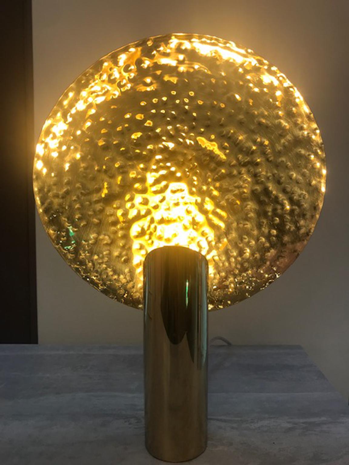 LUNA Contemporary Minimalist Poetic table lamp by Cristiana Bertolucci
Table lamp with contanane design in polished brass. Hand-hammered brass spotlight. The luminaire produces a beautiful reflection of light through the reflector.
The luminaire is