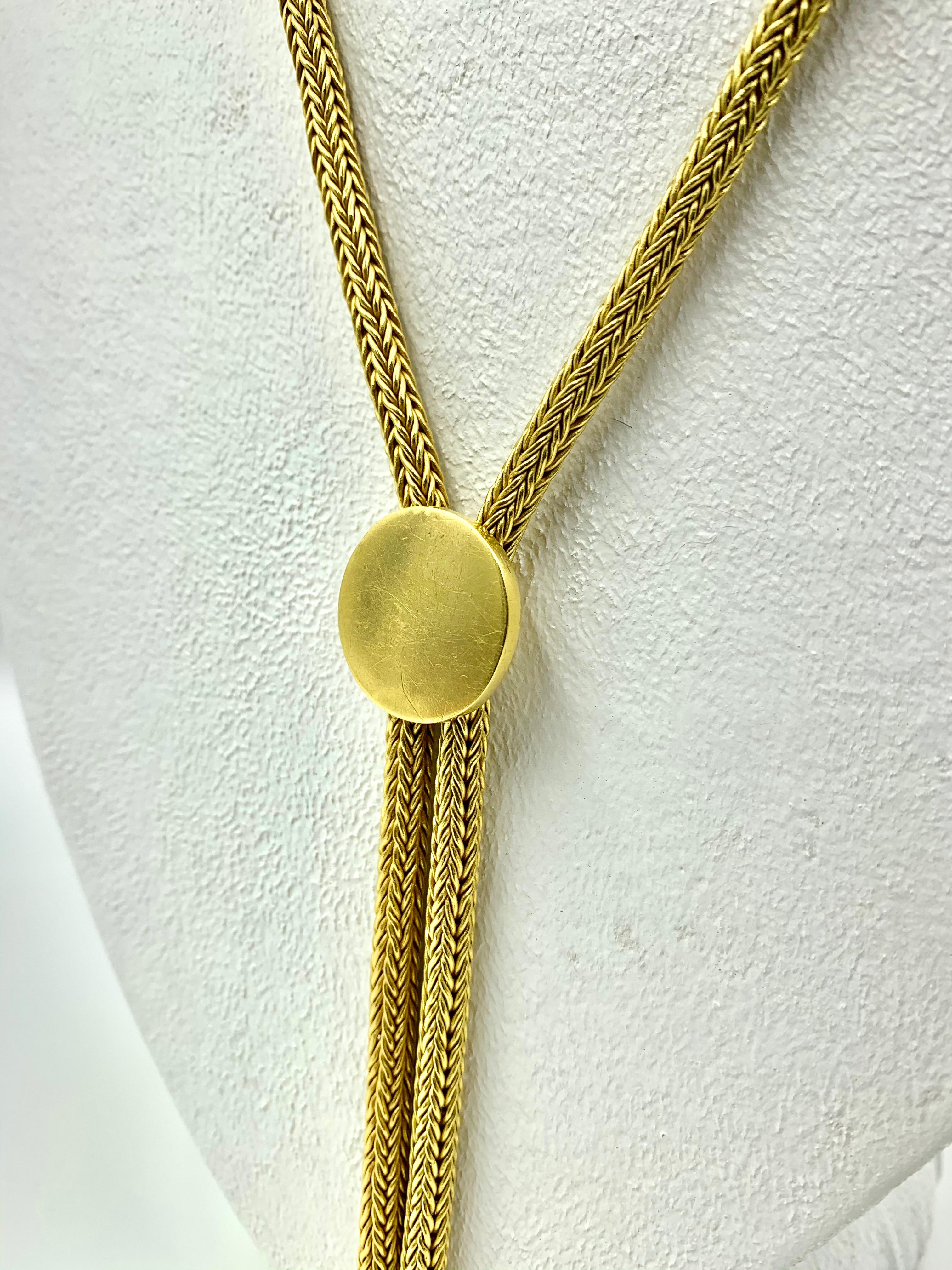 Rare, luxurious 146g 22k gold American classic western style lariat bolo tie necklace by Luna Felix
20th Century
Length: 29.13 inches
Diameter of bolo: 20mm/.79 inches
Weight: 146 grams
Condition: Very Good, beautiful patina with light surface wear