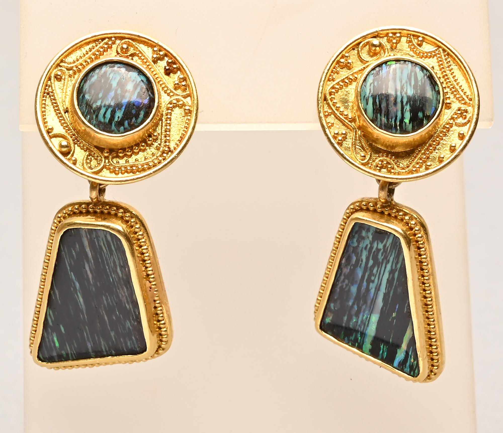 Stunning and unusual drop earrings by American designer, Luna Felix. Felix is known, in part, for her fine Etruscan work. The outer rim of the circular disc has a graceful tiny beadwork design.
The disc measures 5/8 