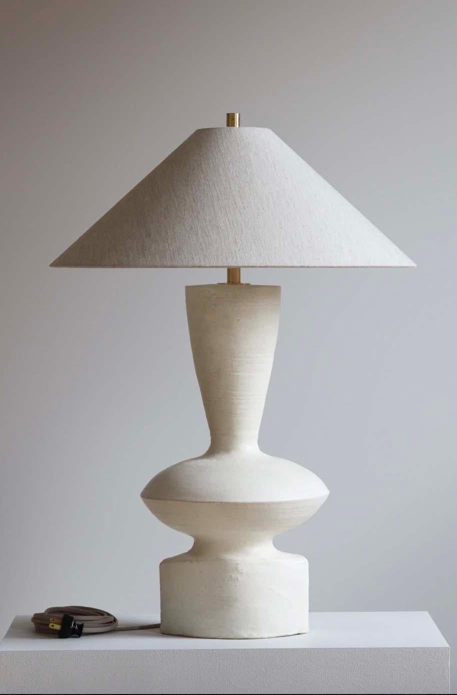 The Luna lamp is handmade studio pottery by ceramic artist by Danny Kaplan. Shade included. Please note exact dimensions may vary.

Born in New York City and raised in Aix-en-Provence, France, Danny Kaplan’s passion for ceramics was shaped by