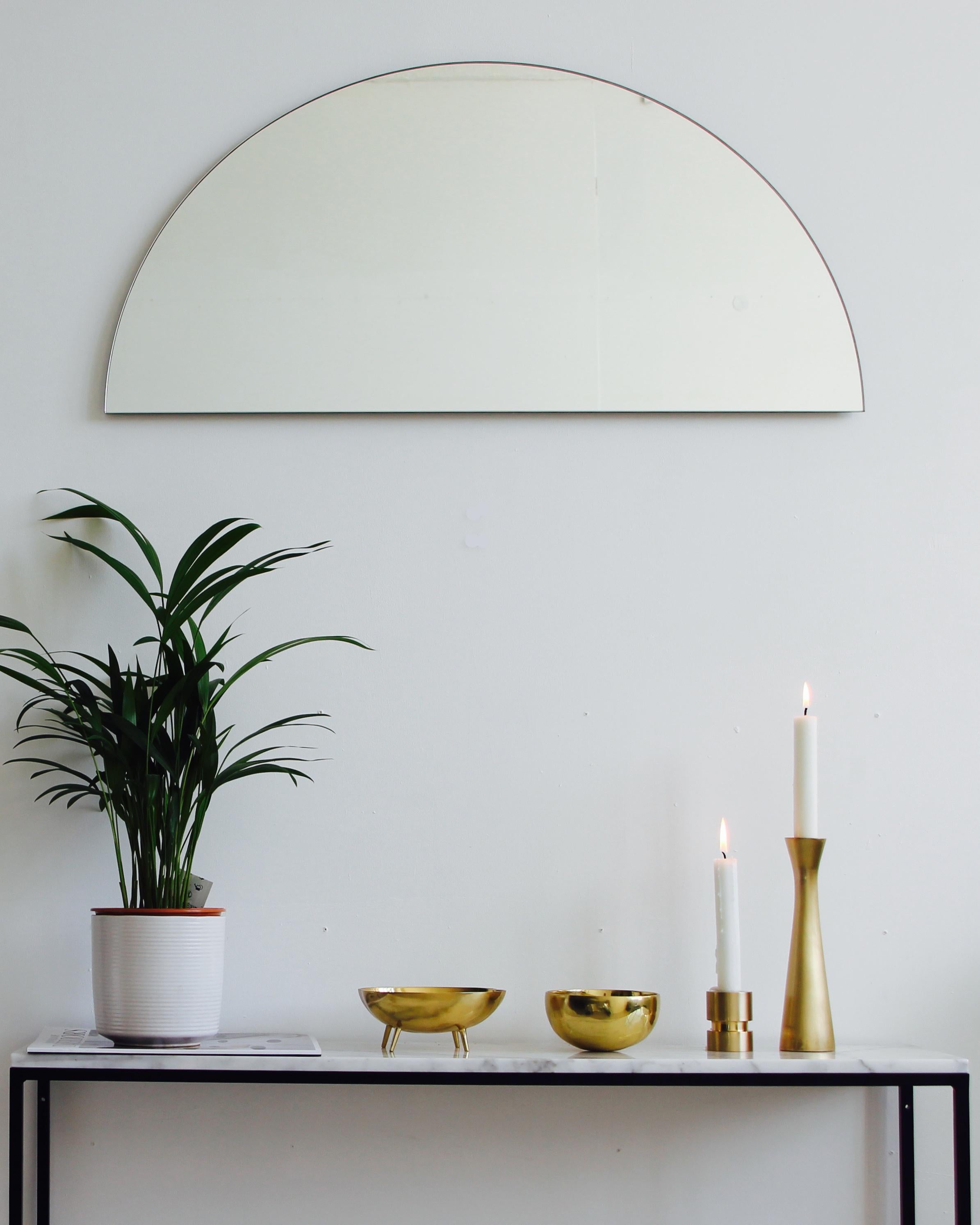 Delightful crafted silver tinted mirror frameless with a floating effect. Design and hand-crafted in London, UK.

Alguacil & Perkoff  new and unusual Luna Orbis™ mirror collection provides the freedom to achieve multiple configurations with one