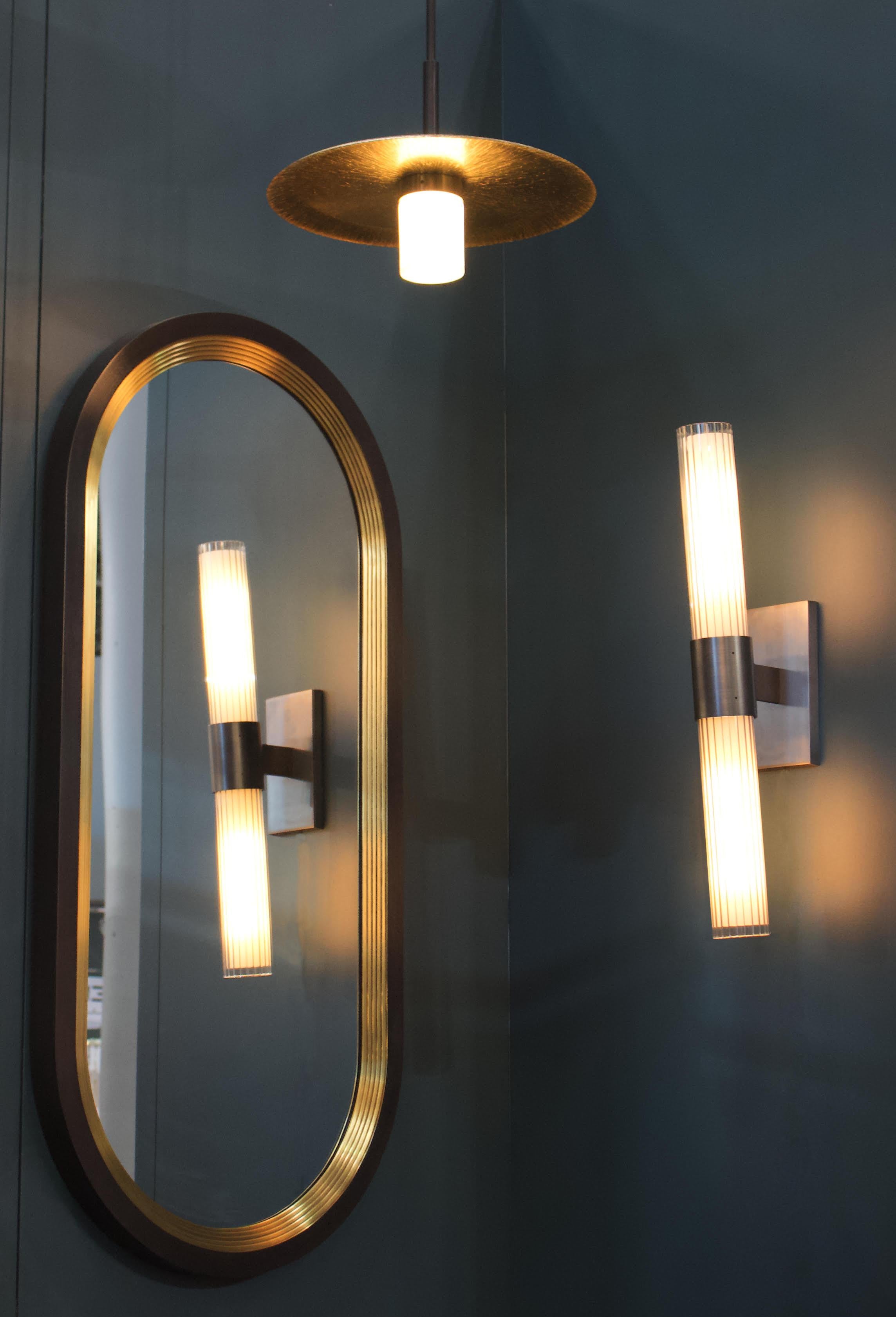Inspired by the visual impact of archivolts used in cathedral architecture, the Luna mirror is a bold layering of solid brass arches. Each Luna is made-to-order to client specifications meaning that custom profiles are available on request.
