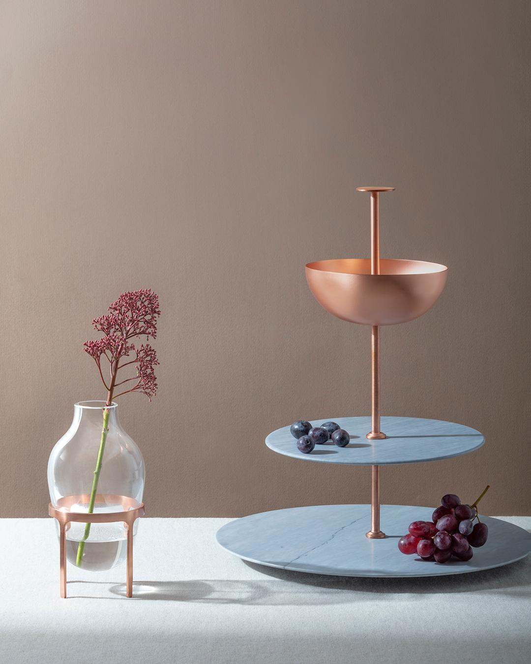 Lunar Cycle is a multi-layered stand made of two circular levels in Grigio Versilia – an Italian gray variety of marble – and a copper bowl, joined up by a thin copper elements. This Piece is part of the Lunar Landscape collection designed by Elisa